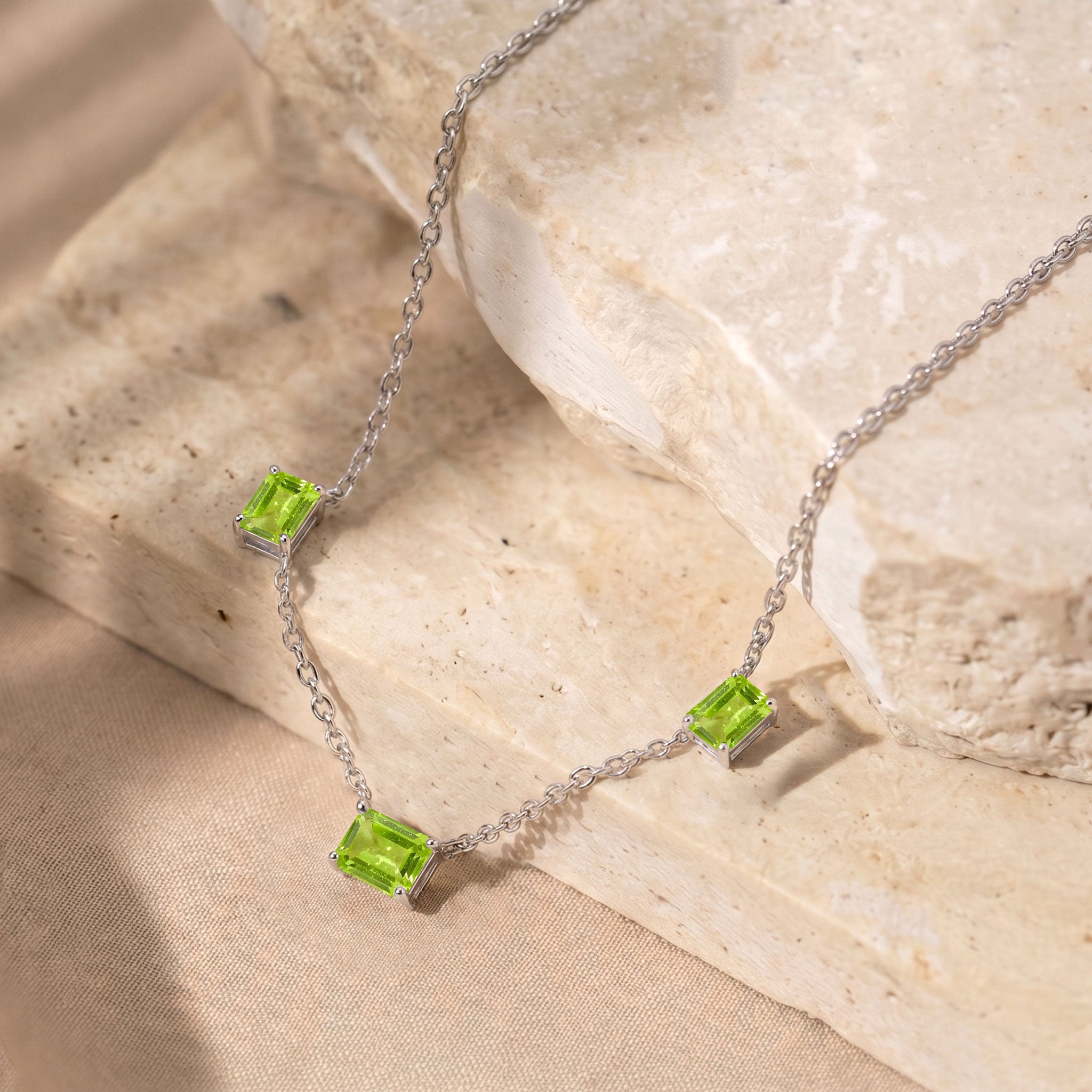 Octagon cut Peridot gemstone necklace close up
