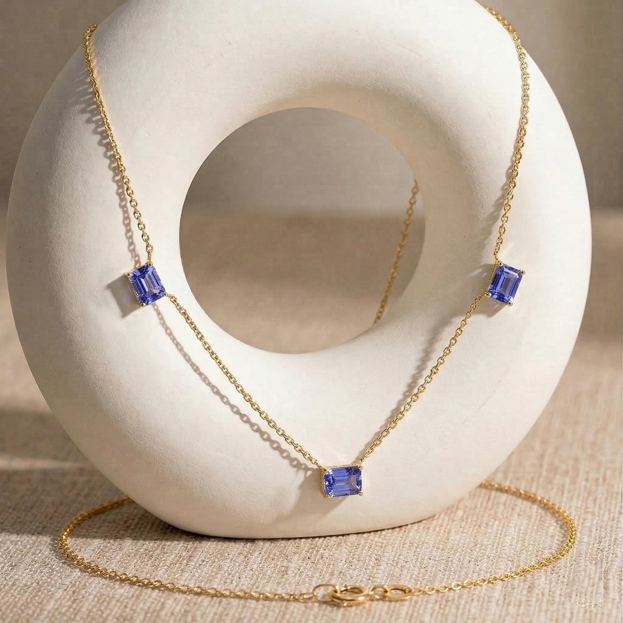 Natural Tanzanite necklace featuring three gemstone stations in sterling silver
