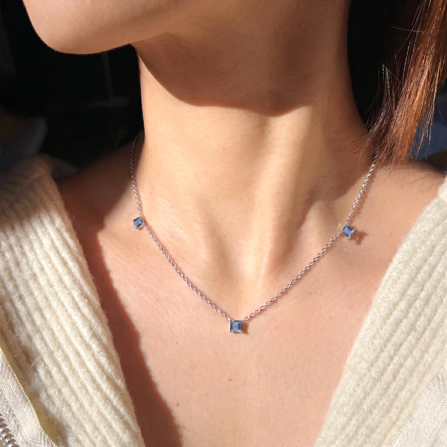 Women's Alexandrite gemstone necklace in sterling silver with modern station styling.
