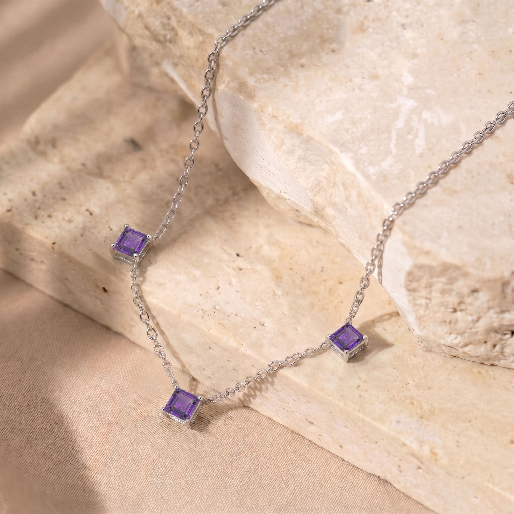 Dainty Amethyst gemstone necklace with purple stones and yellow gold filled finish for women.
