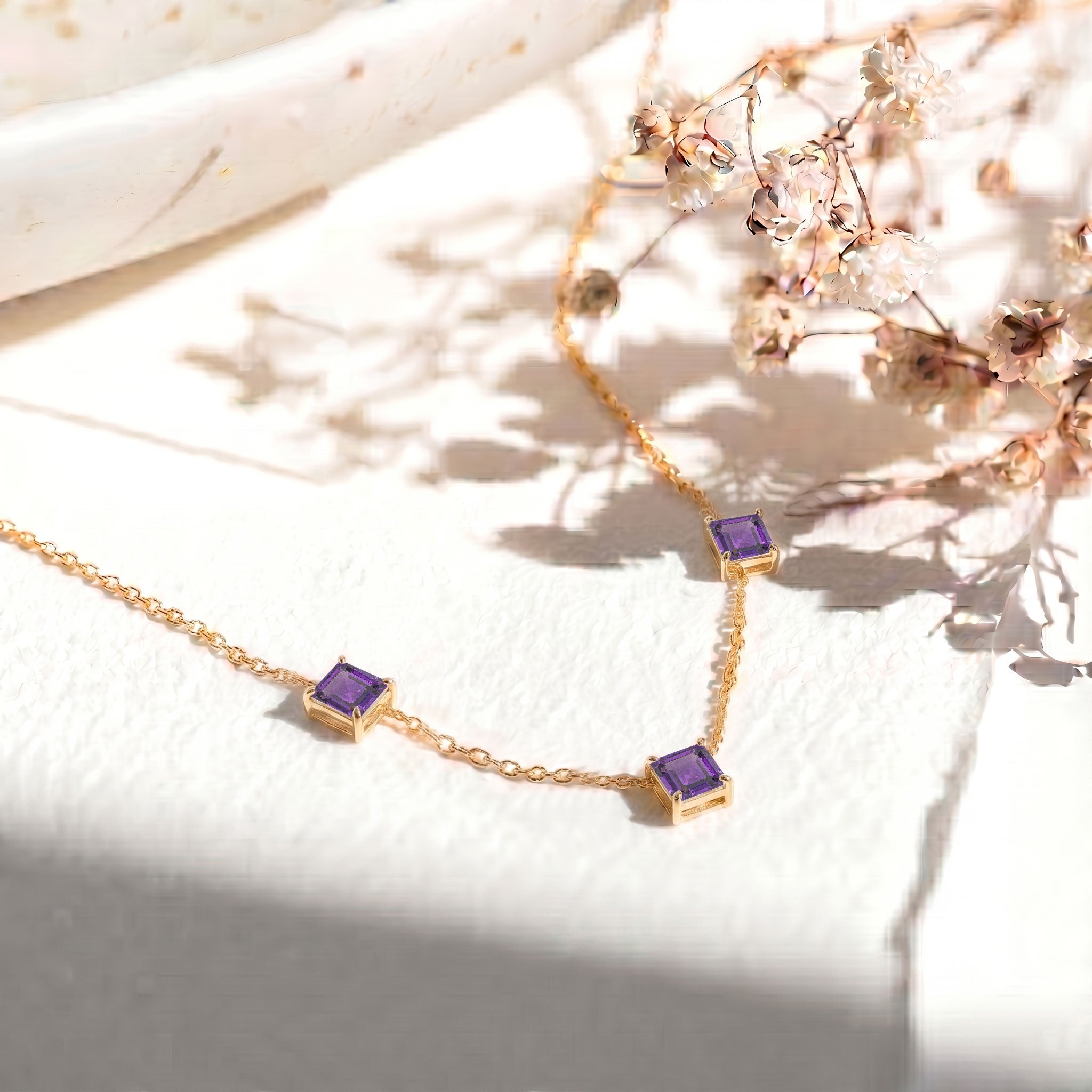 February birthstone Amethyst necklace with elegant three stone design for women.
