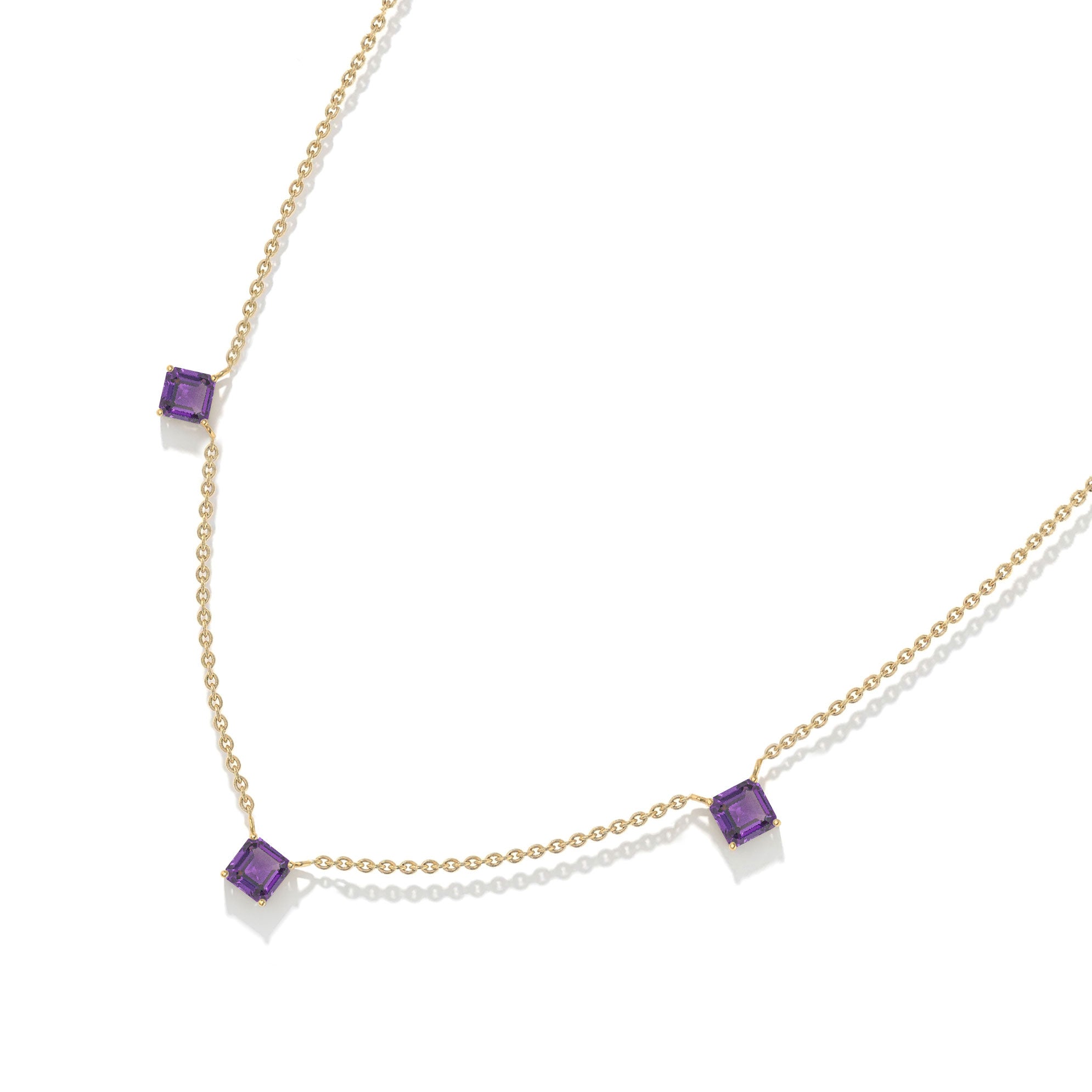 Minimalist purple gemstone necklace with Amethyst stones and sterling silver craftsmanship.
