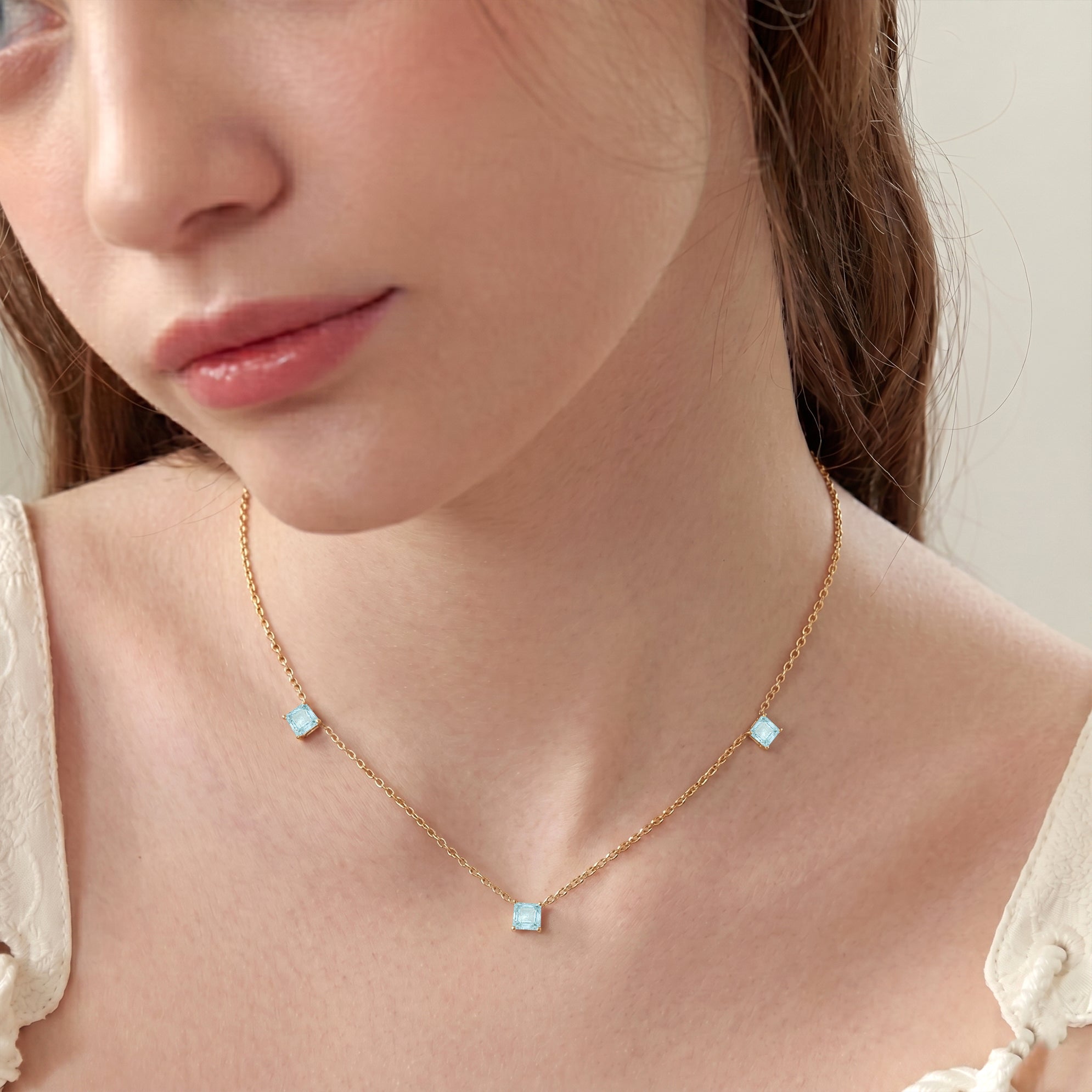 Modern Aquamarine station necklace with polished sterling silver chain.
