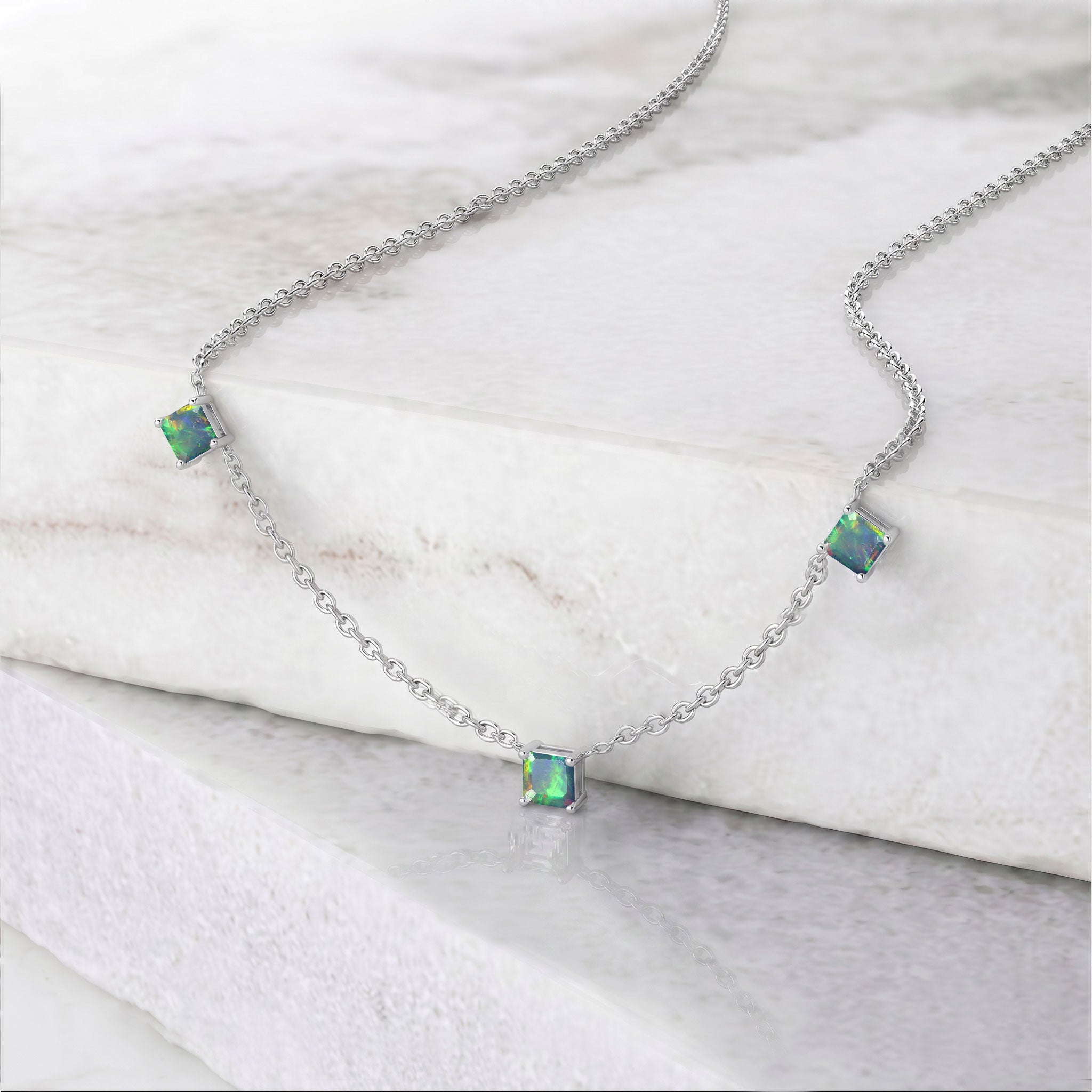 Genuine Natural Black Opal necklace with three square cut gemstones and adjustable chain.
