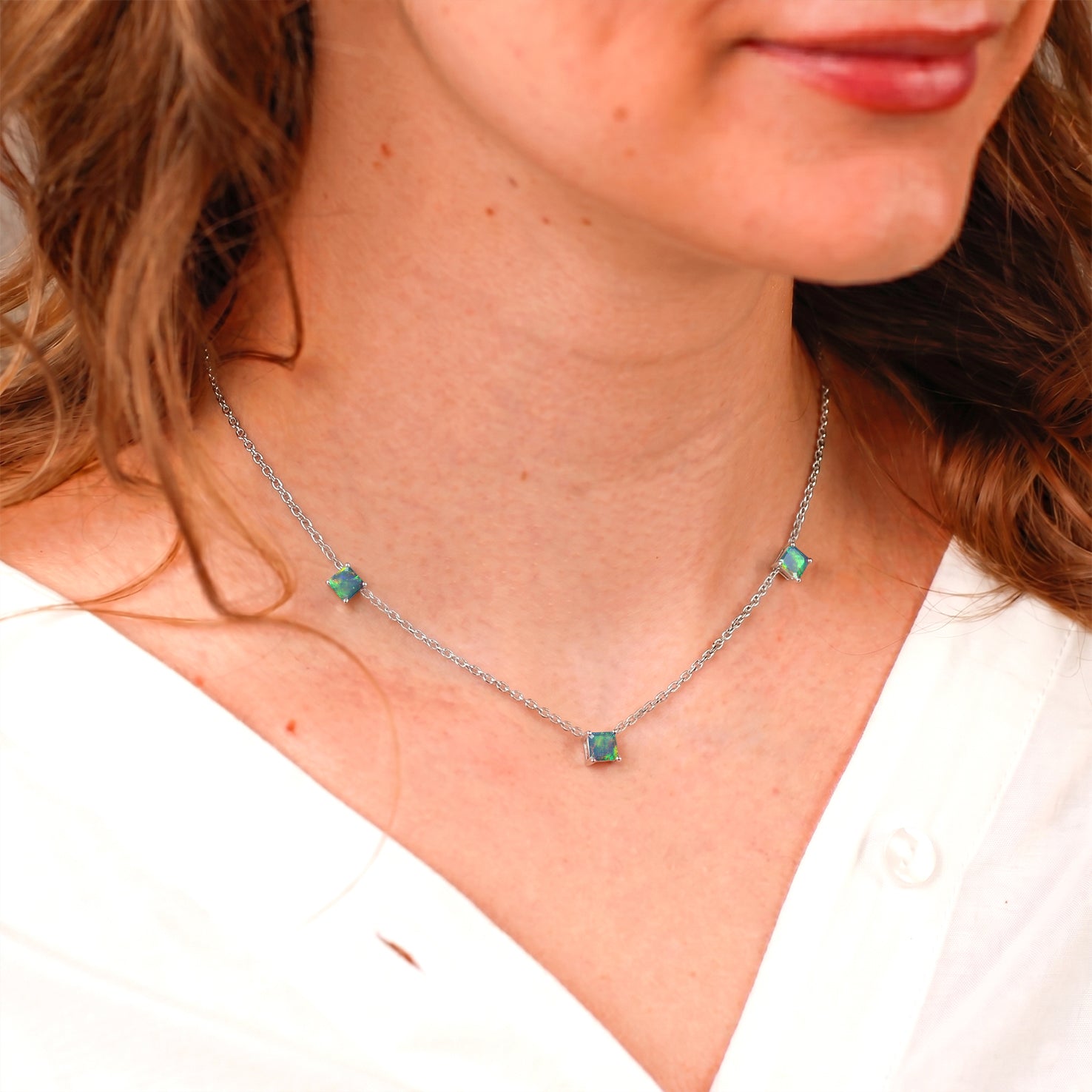 Dainty Natural Black Opal station necklace featuring three Asscher cut gemstones.
