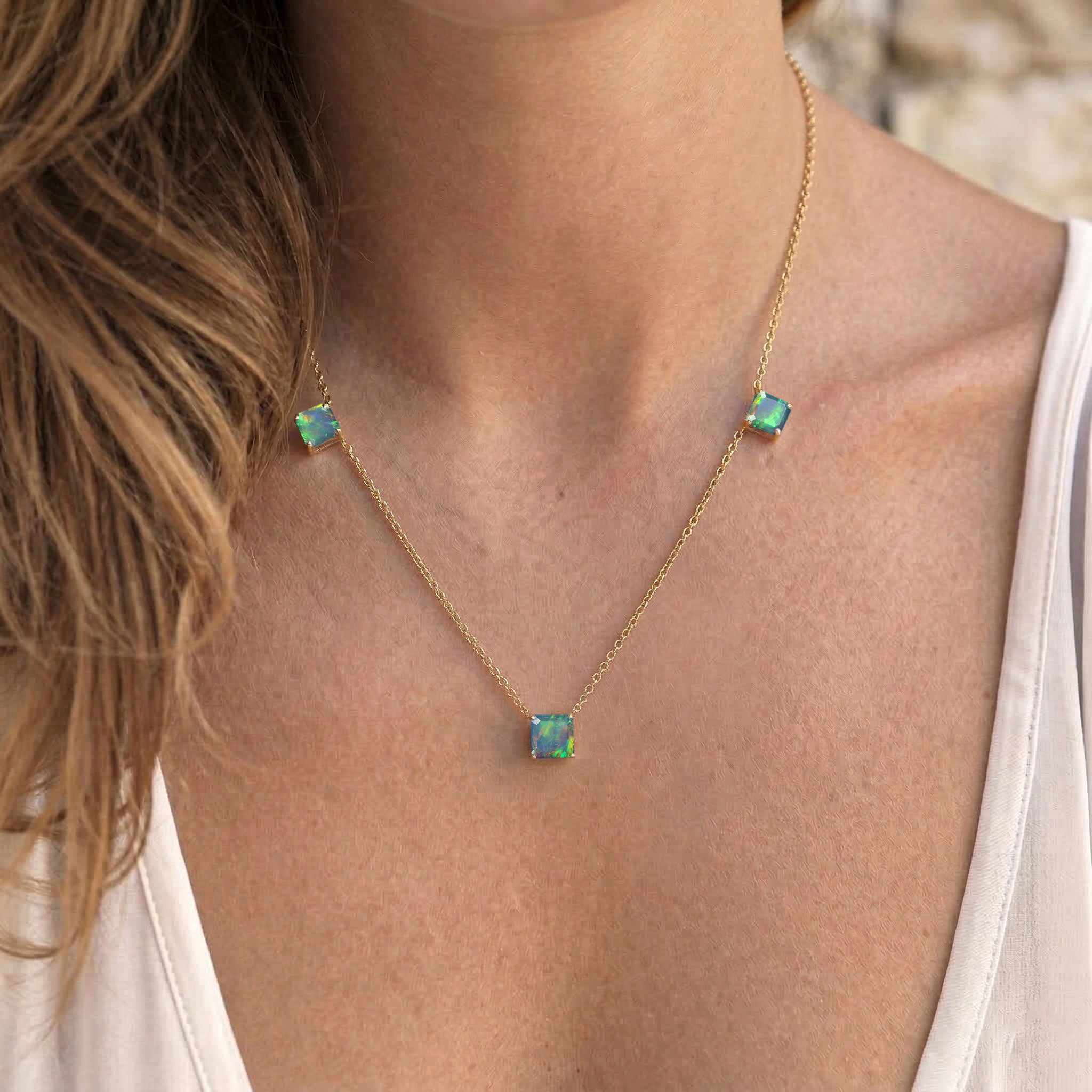 Luxury Natural Black Opal gemstone necklace with three Asscher cut stones.
