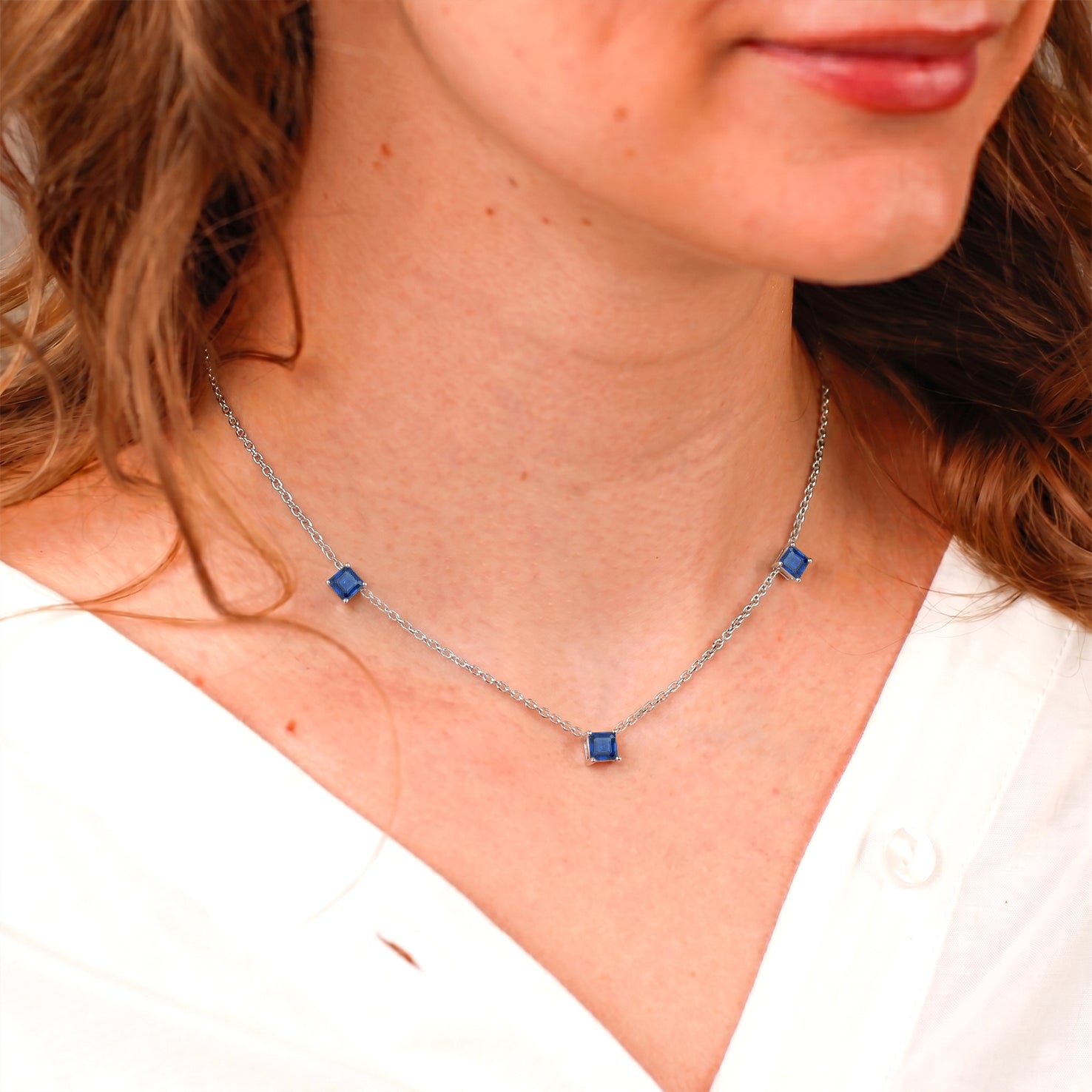 September birthstone Blue Sapphire necklace with sparkling Asscher cut gemstones.
