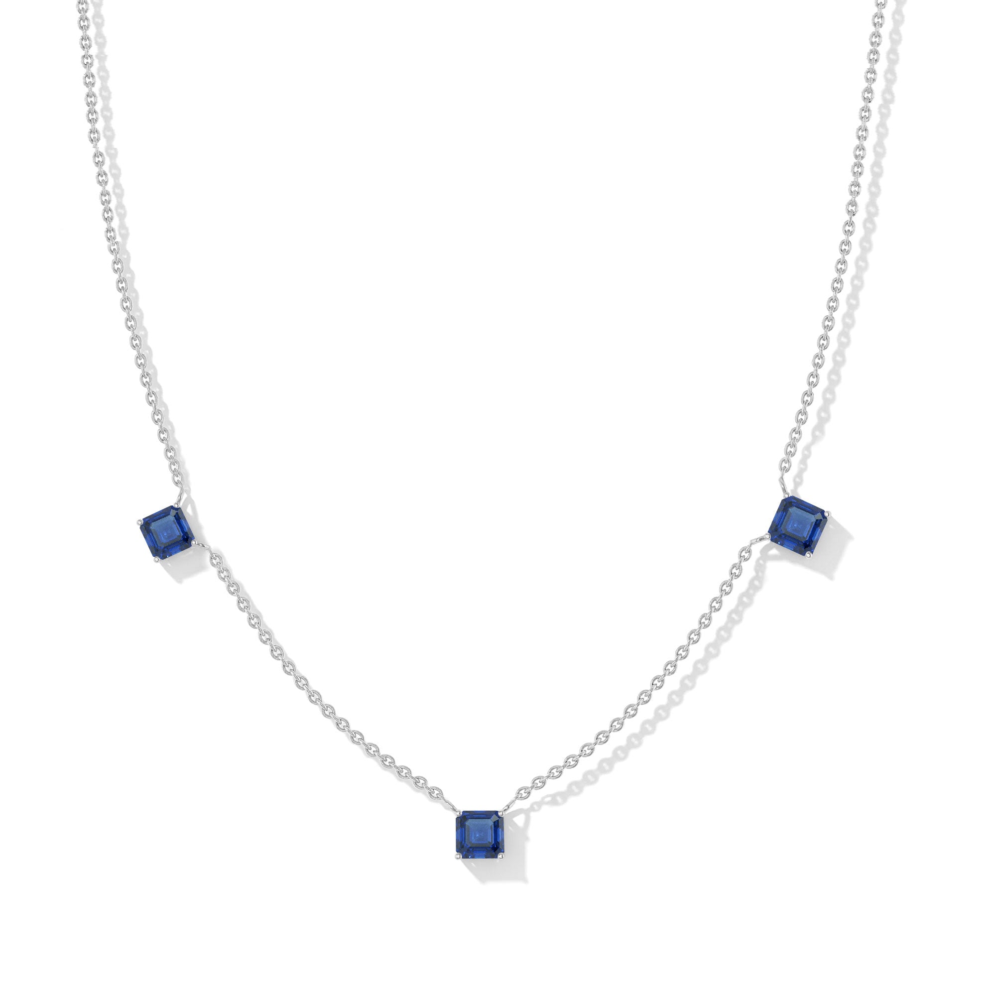 "Elegant Blue Sapphire Asscher cut necklace with three deep blue gemstones in sterling silver.
