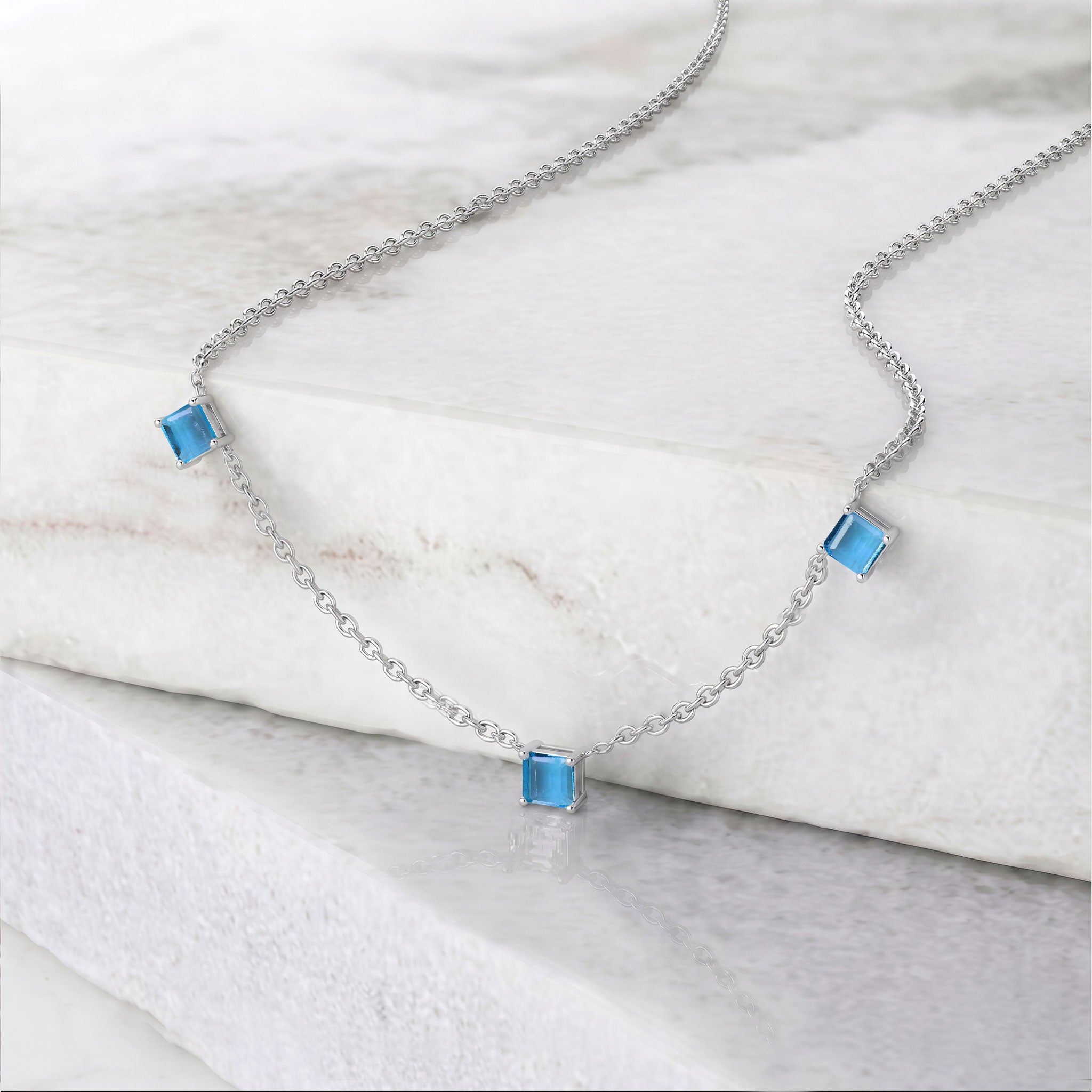 Genuine Blue Topaz gemstone necklace with adjustable sterling silver chain.
