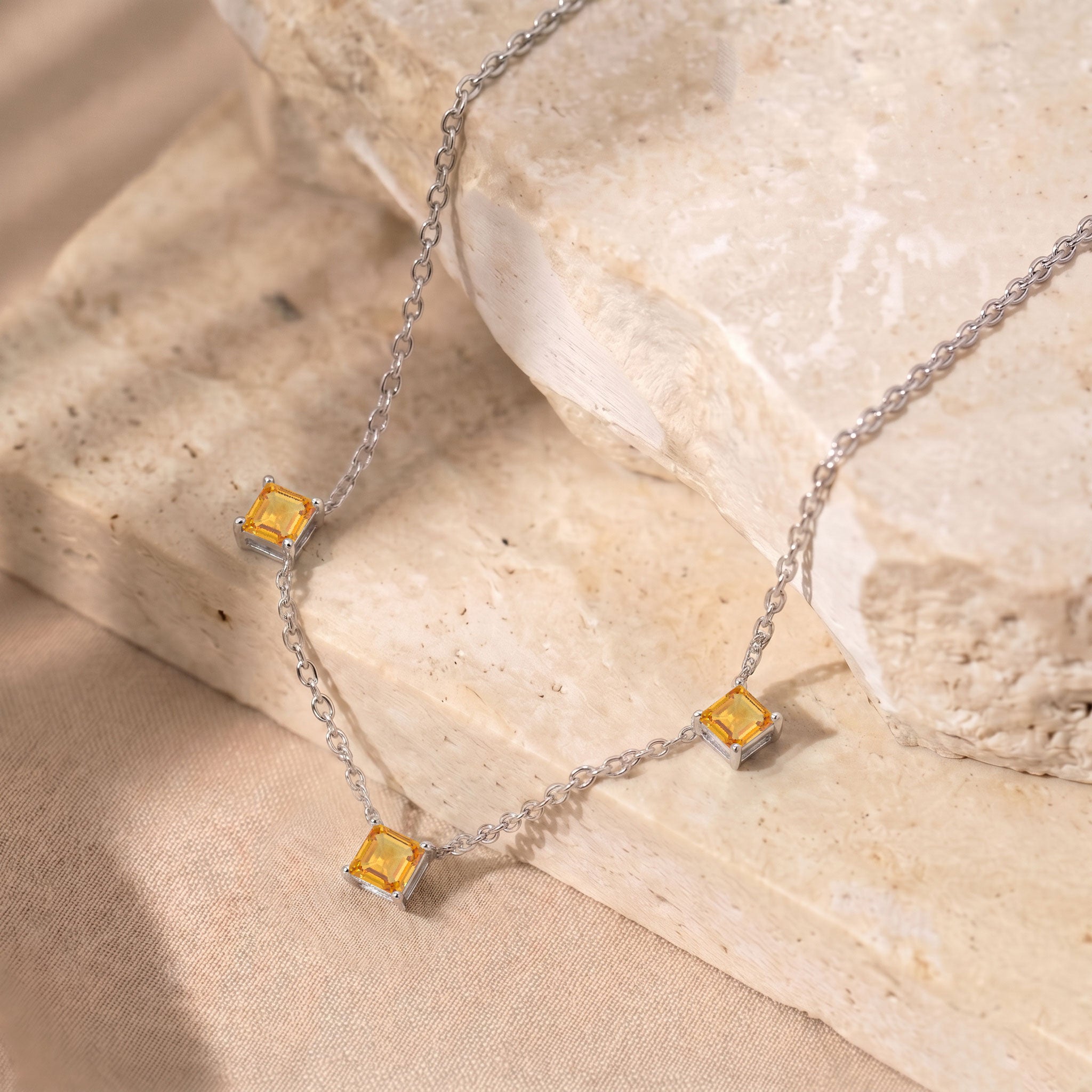 Elegant November birthstone Citrine necklace with a delicate three stone setting.
