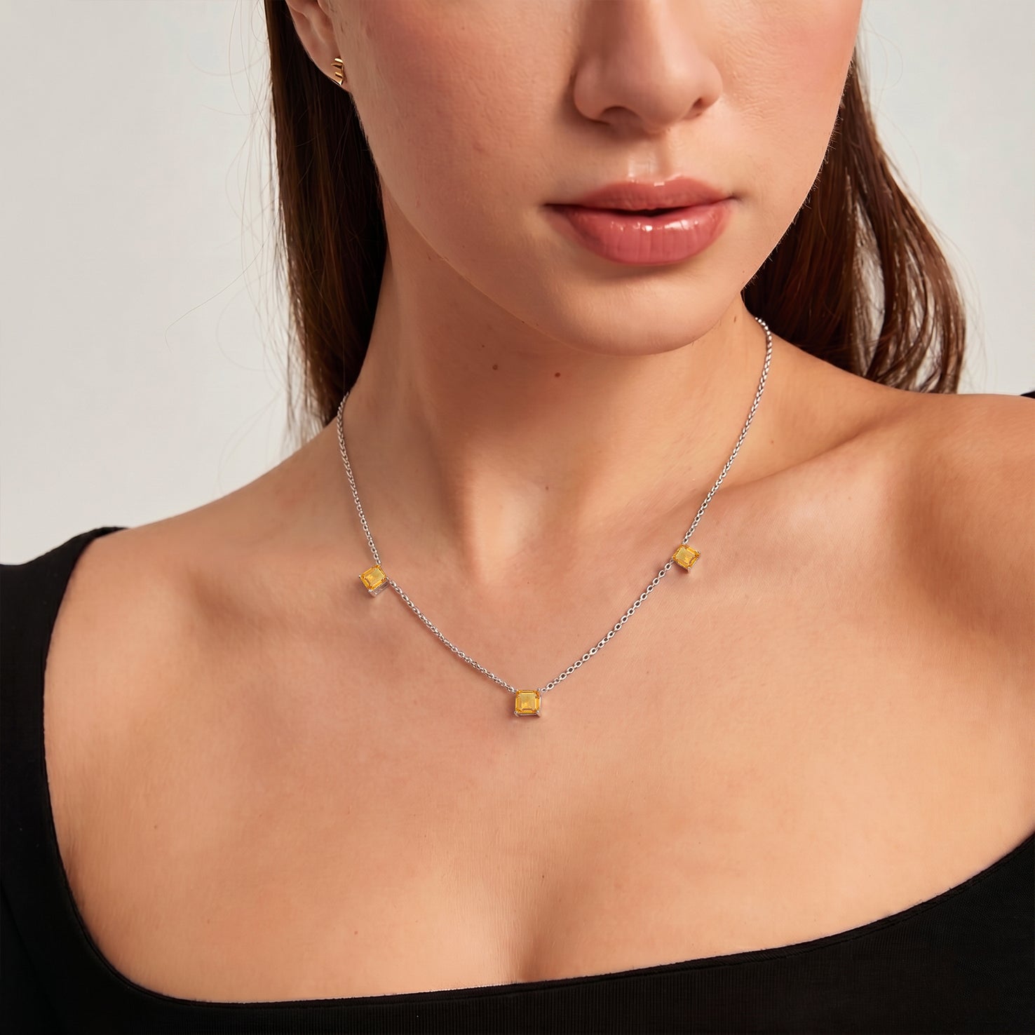 Yellow gold filled Citrine necklace with three faceted gemstone details.
