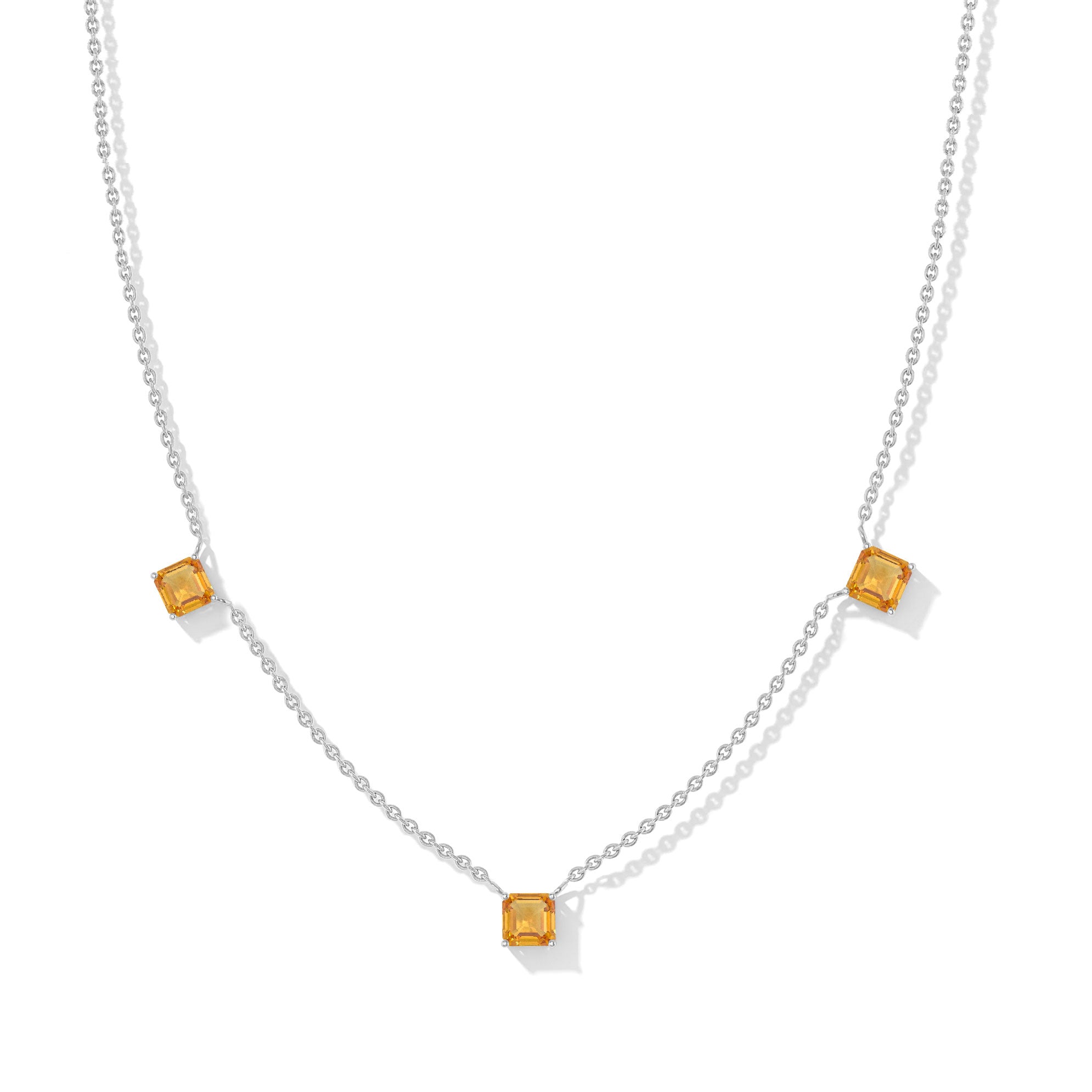 "Citrine Asscher cut station necklace with three golden gemstones in sterling silver design.
