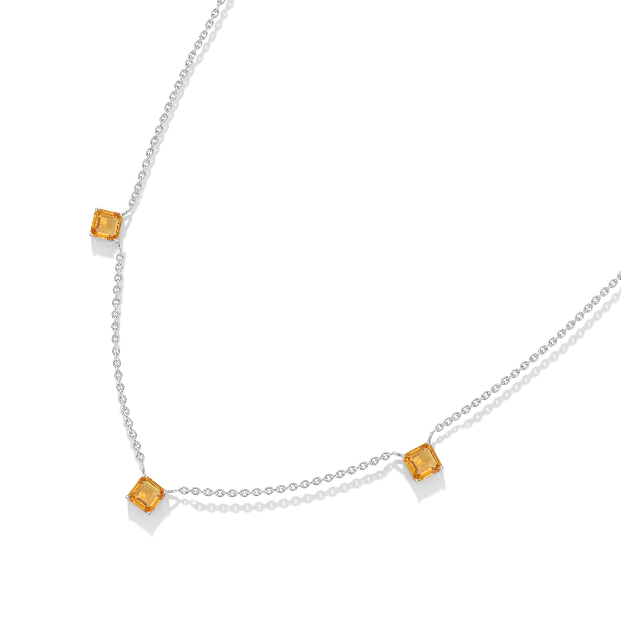 Dainty gold Citrine necklace with three Asscher cut gemstone accents.
