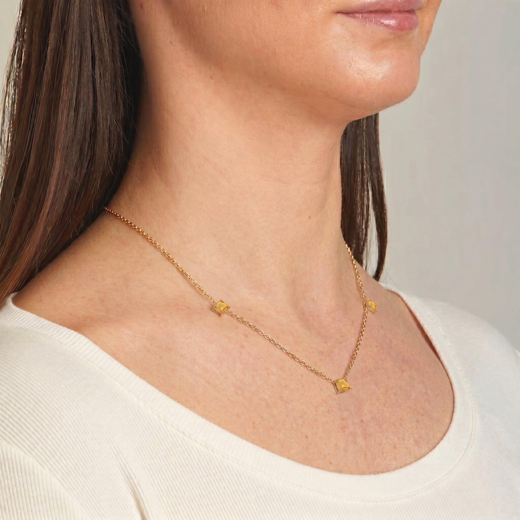 Modern Citrine necklace with elegant Asscher cut gemstone arrangement.
