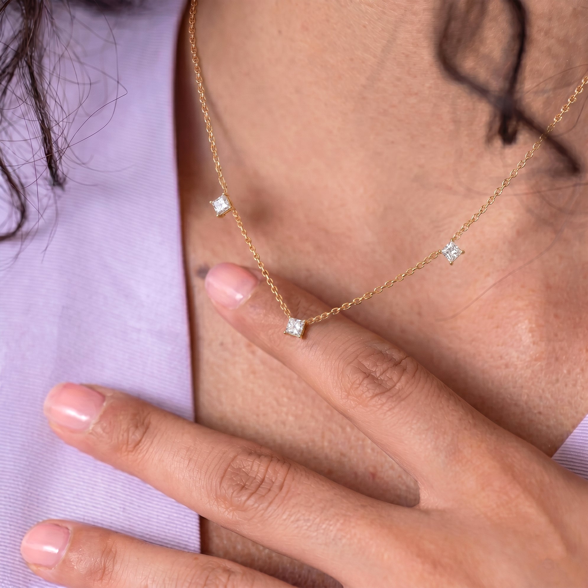 Luxury Asscher cut Moissanite necklace with three sparkling gemstones on a delicate sterling silver chain.

