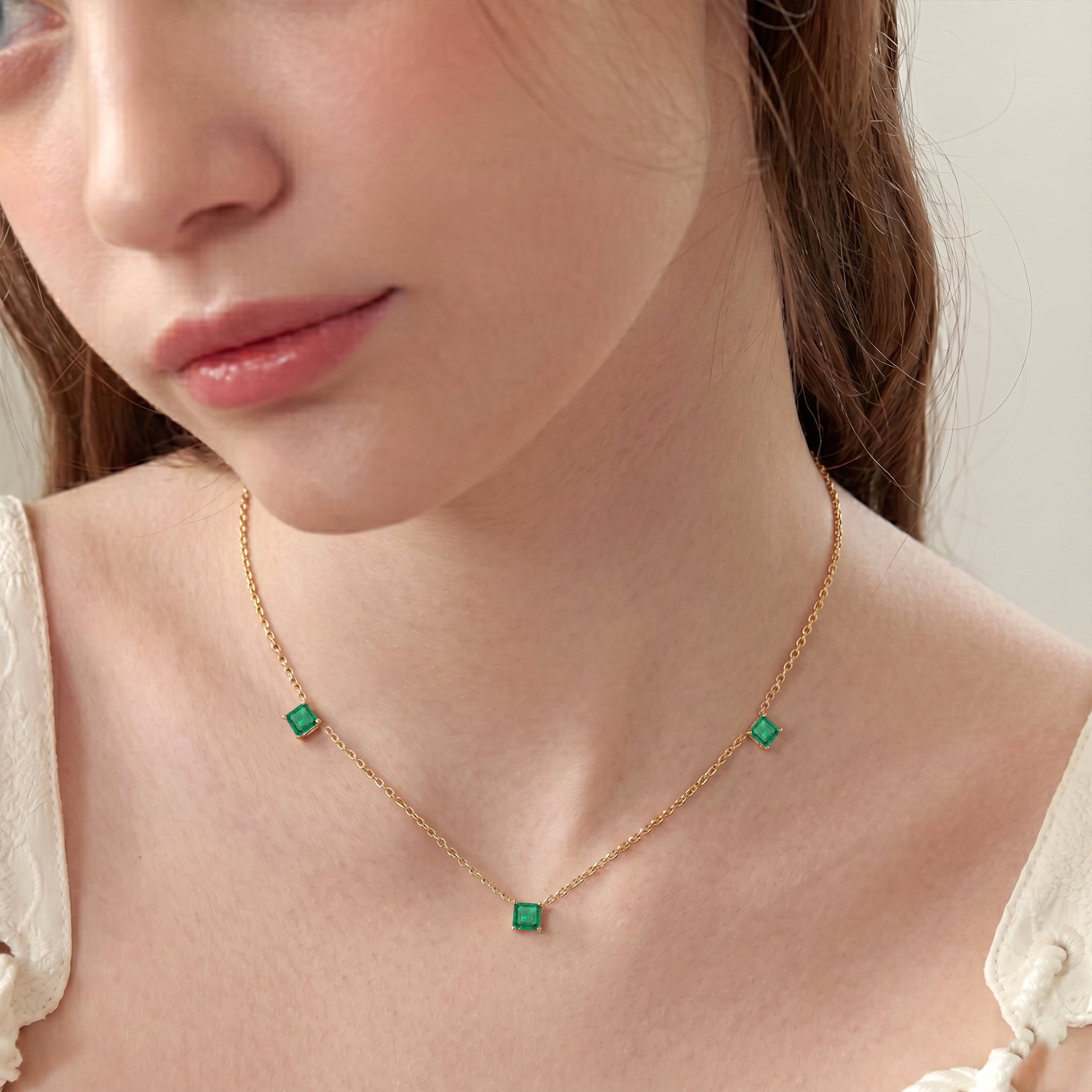 Handmade Emerald necklace showcasing premium Asscher cut gemstones.
