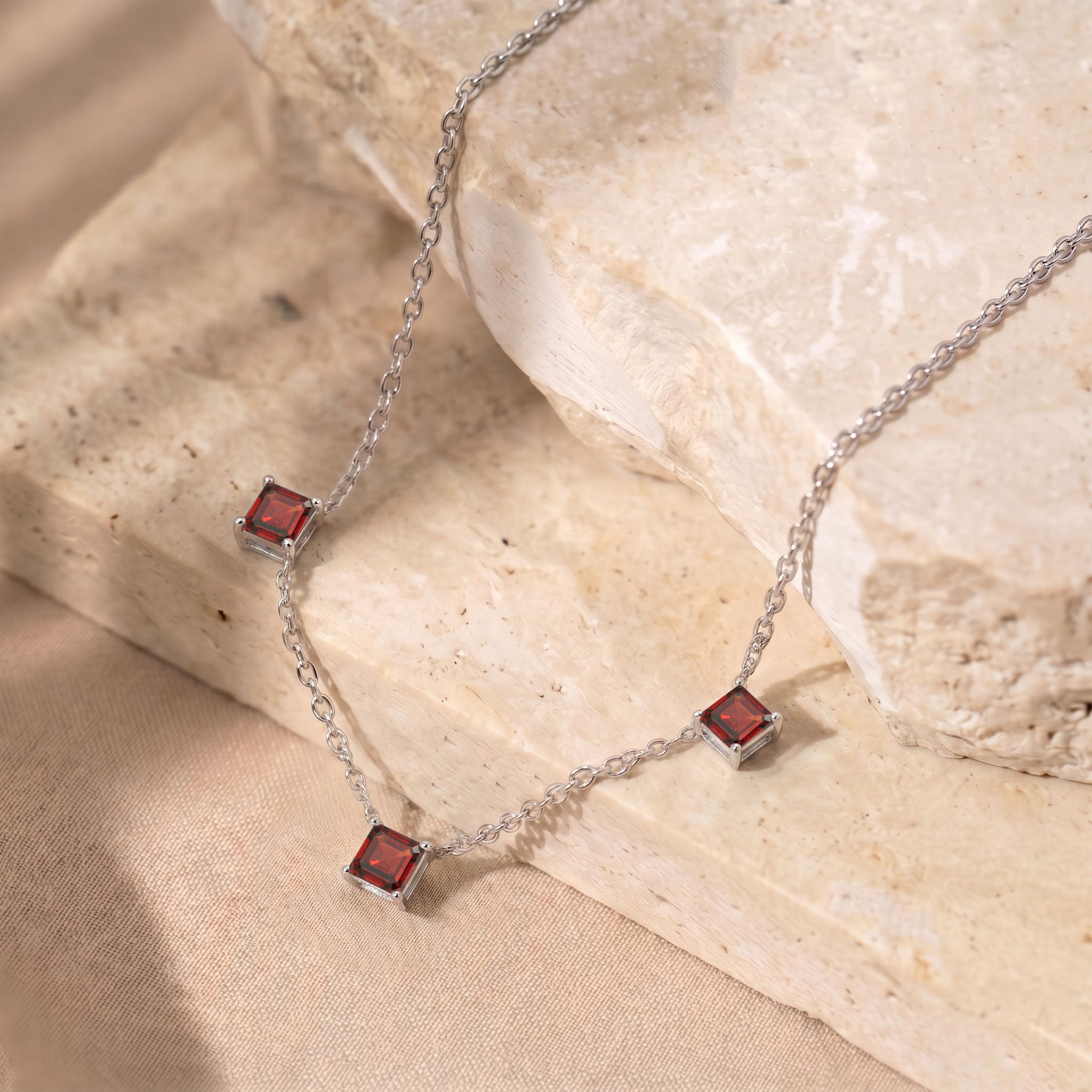 January birthstone Garnet necklace with sparkling Asscher cut gemstones.
