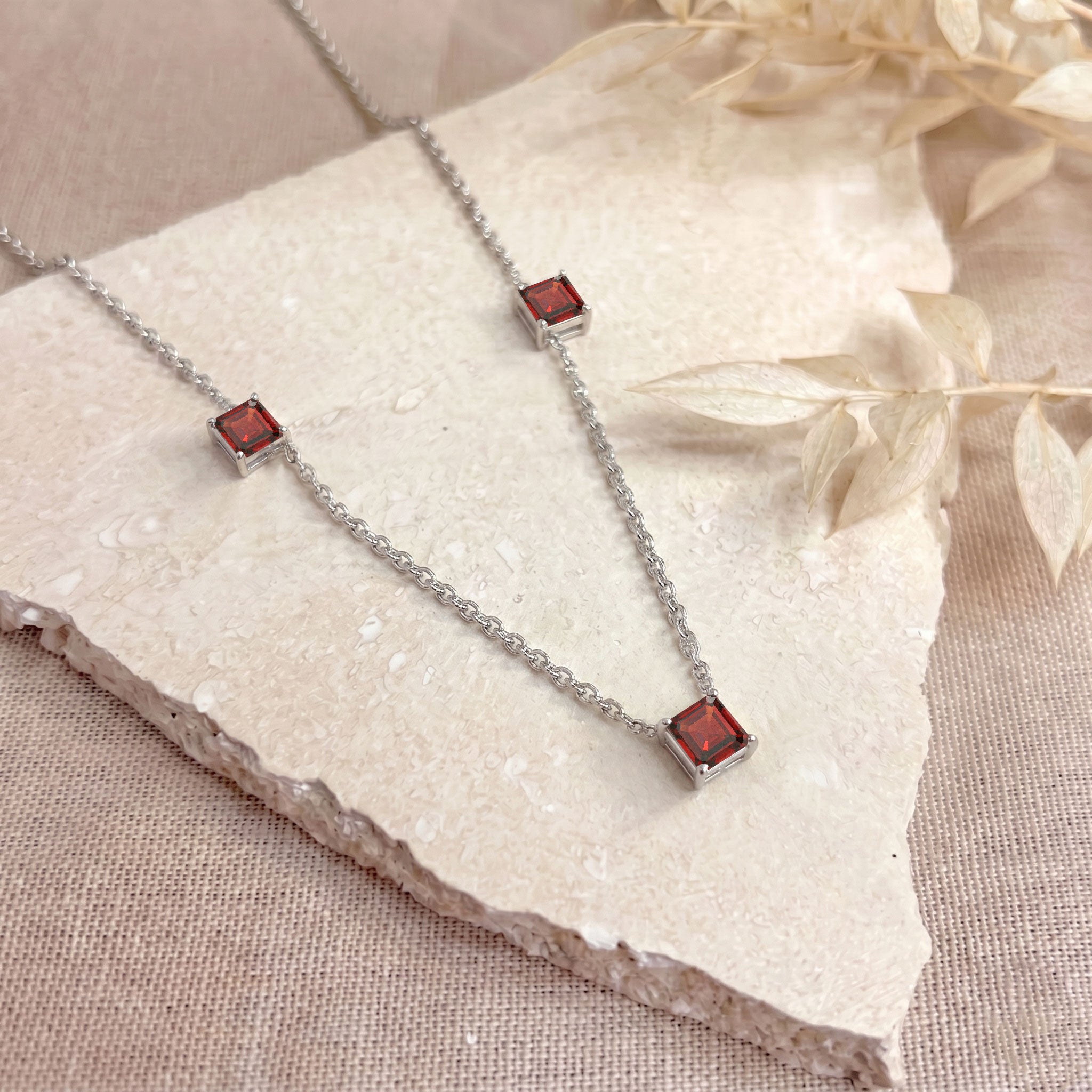 Genuine Garnet gemstone necklace with adjustable sterling silver chain.
