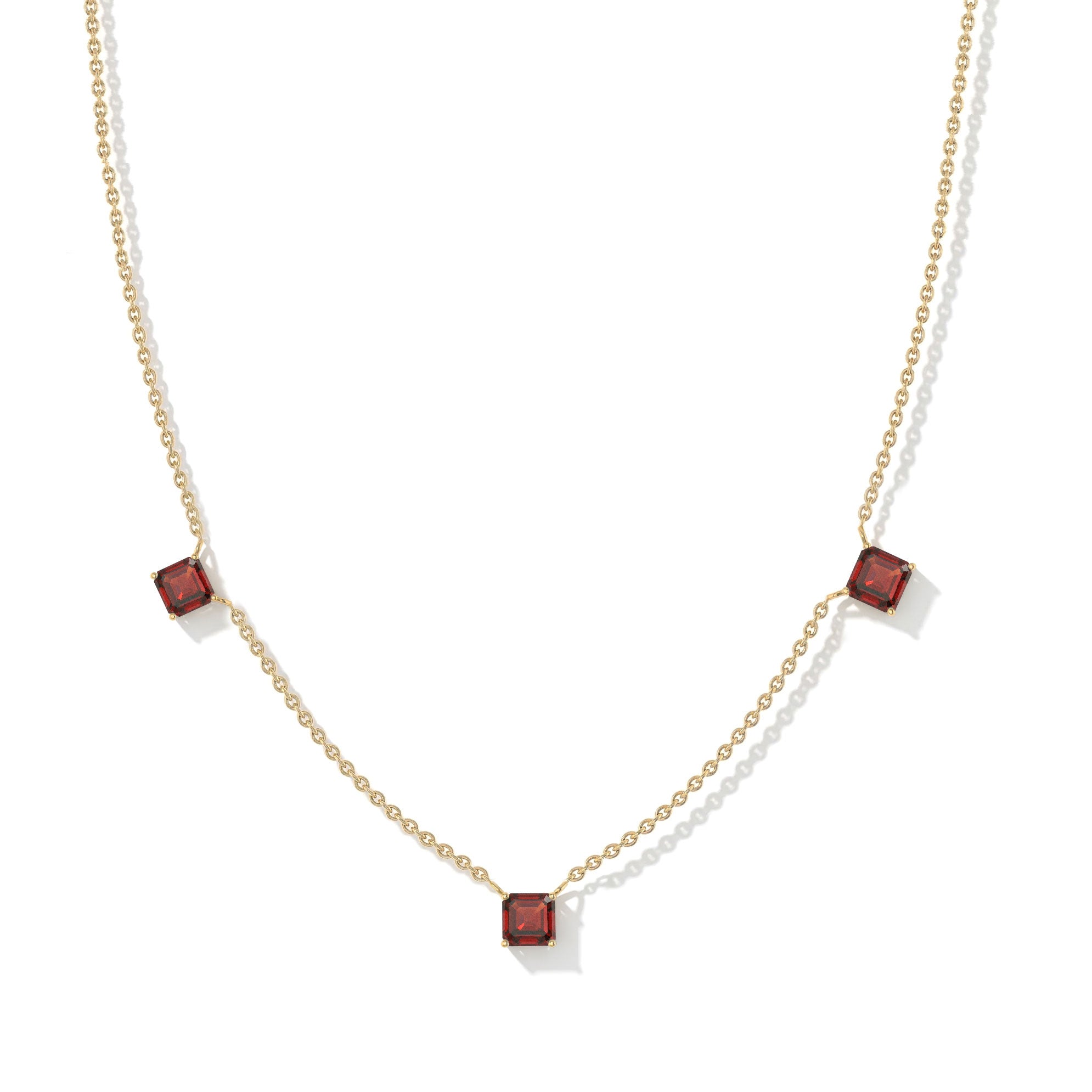 Contemporary Garnet necklace with minimalist three stone station design.
