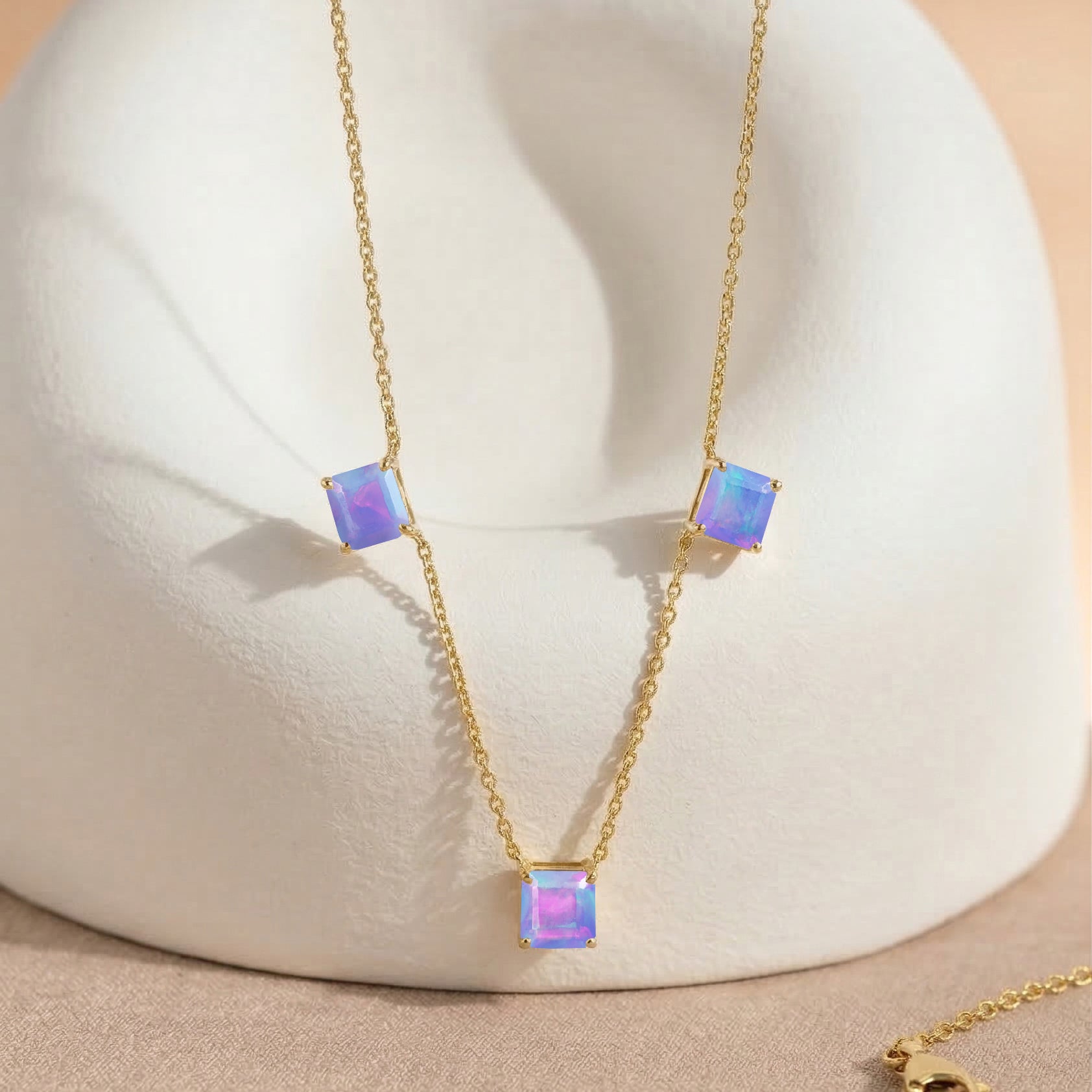 Minimalist Lavender Opal gemstone necklace with three Asscher cut stones on a 925 sterling silver yellow gold filled chain for women.
