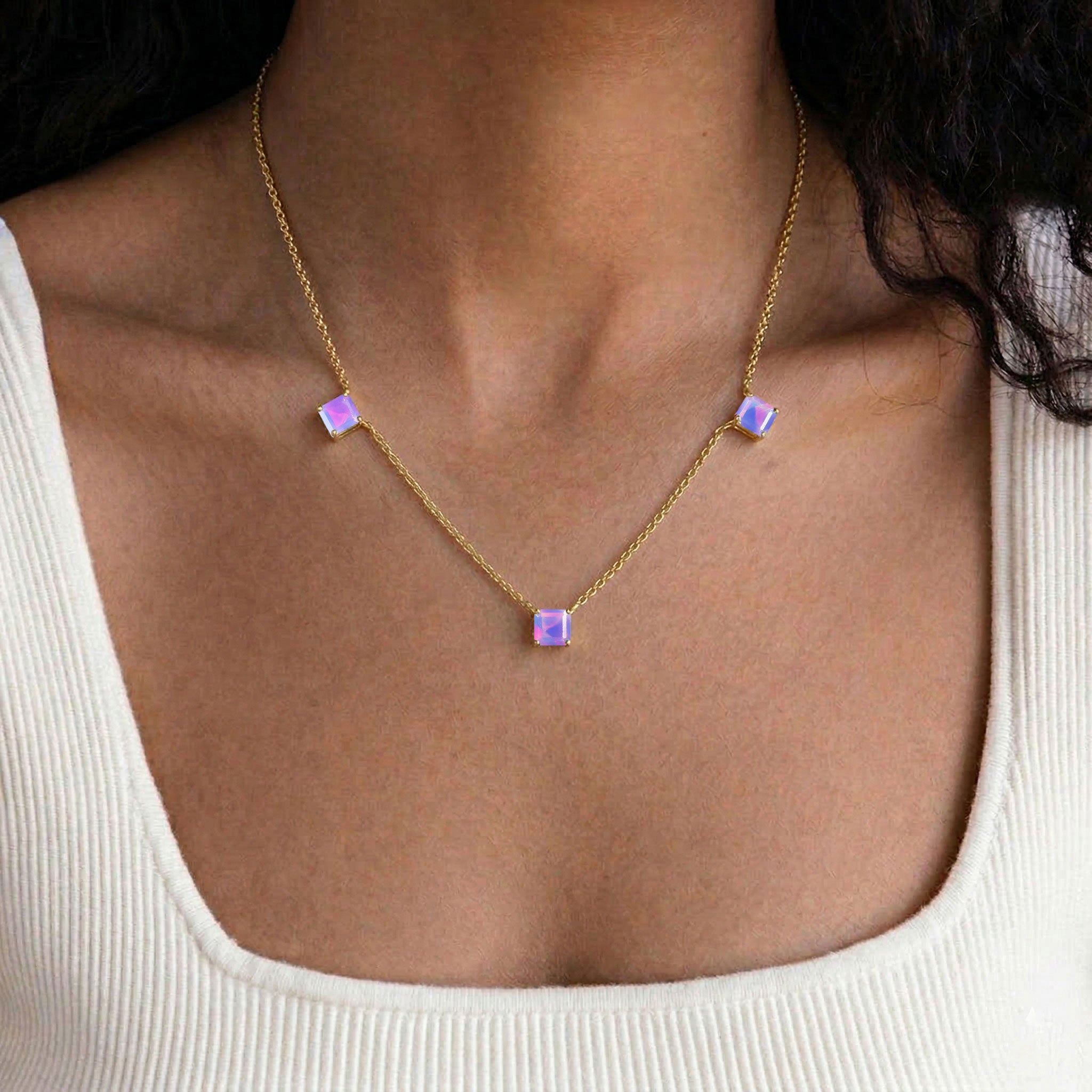 Delicate Lavender Opal gemstone necklace designed with three Asscher cut stones, adjustable chain, and elegant sterling silver craftsmanship.
