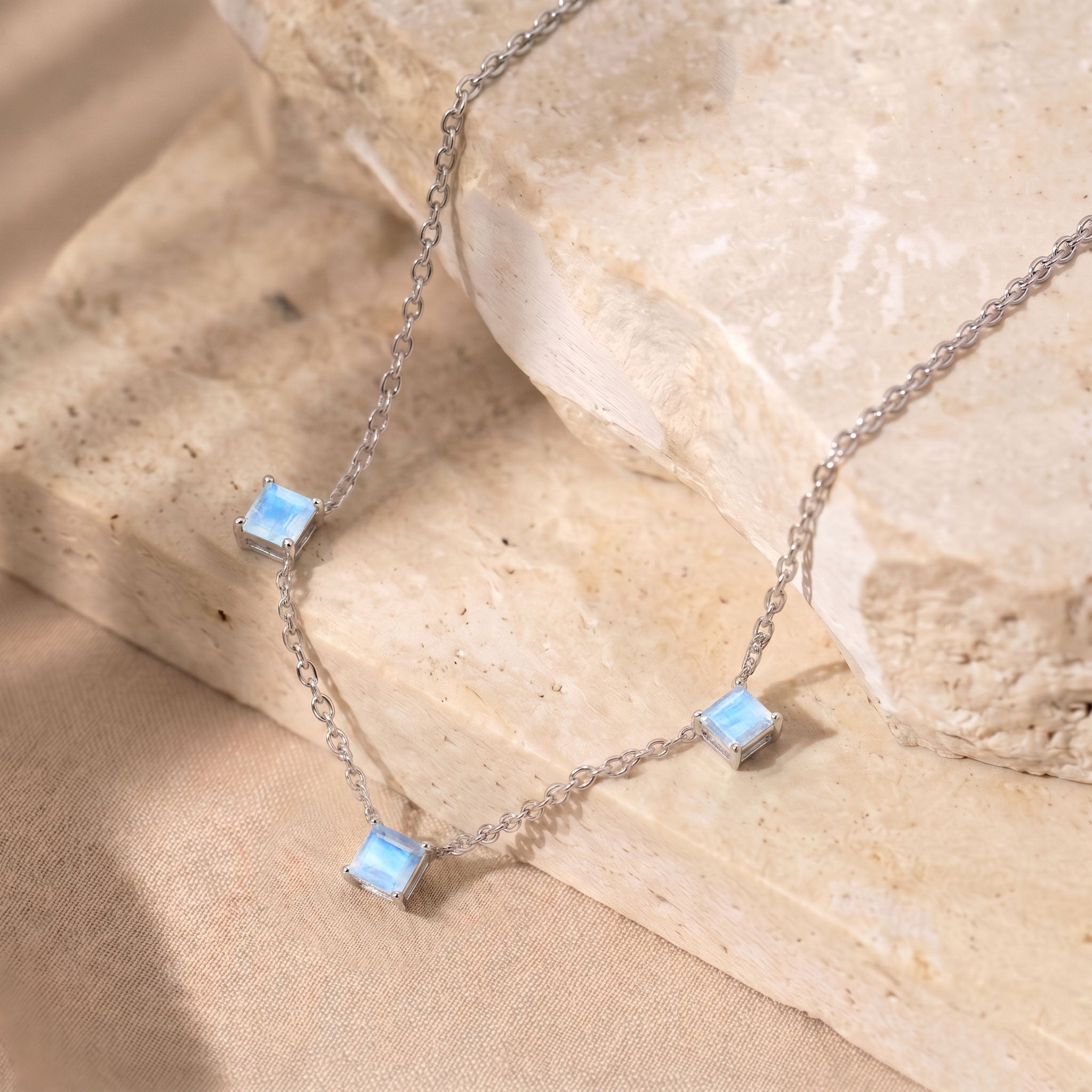Minimalist Moonstone gemstone necklace with approximately 1.95 carat total weight and adjustable chain.

