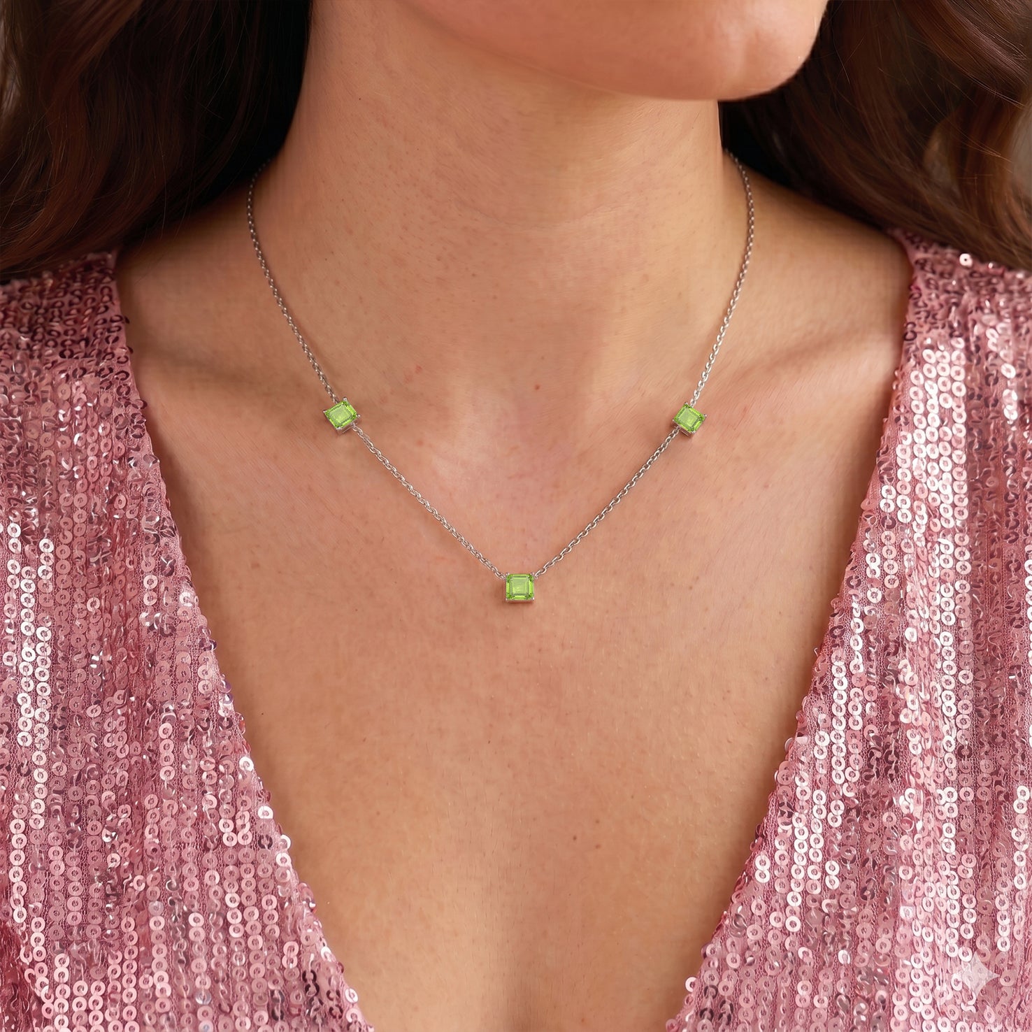 Natural Peridot necklace with approximately 1.95 carat gemstone weight and adjustable 16 inch chain.
