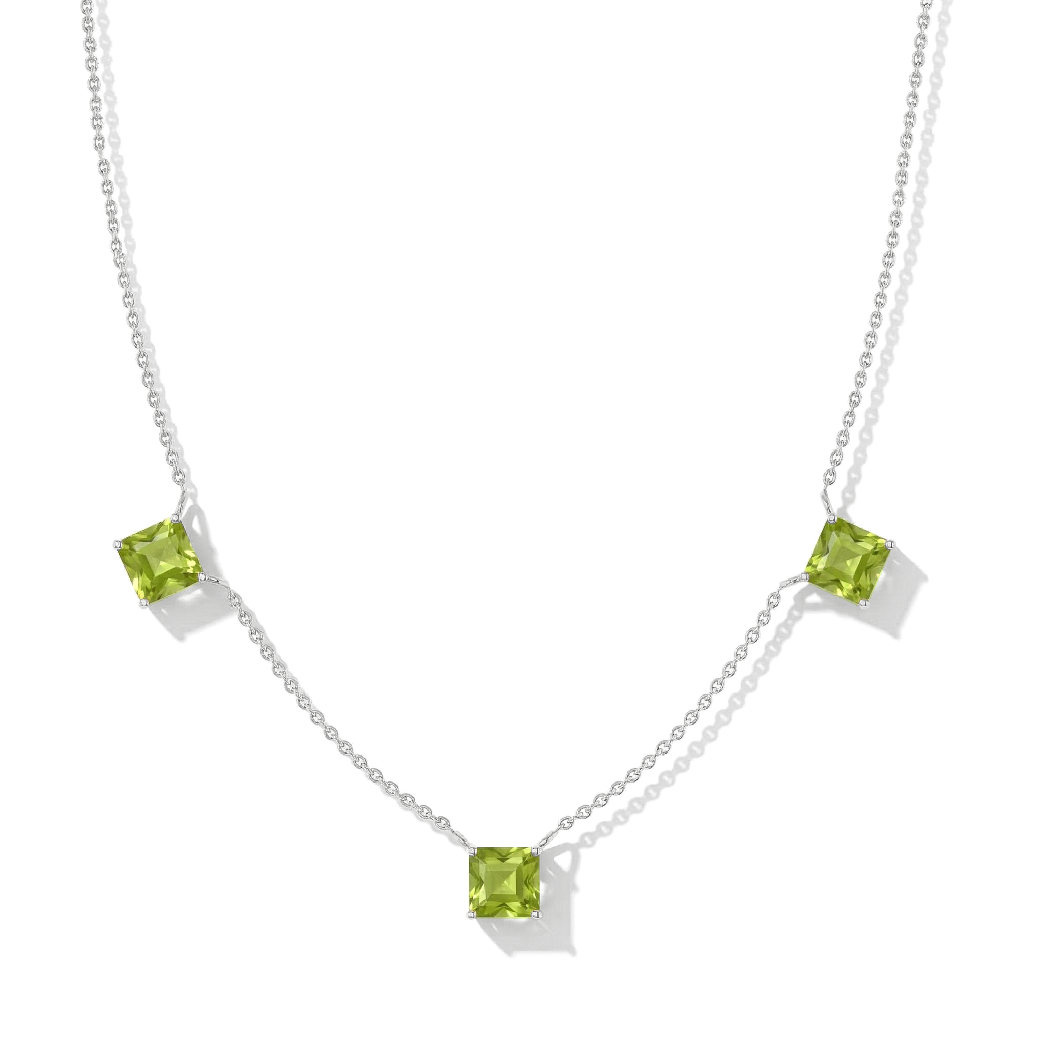 "Peridot Asscher cut station necklace in yellow gold filled and 925 sterling silver with three green gemstones.
