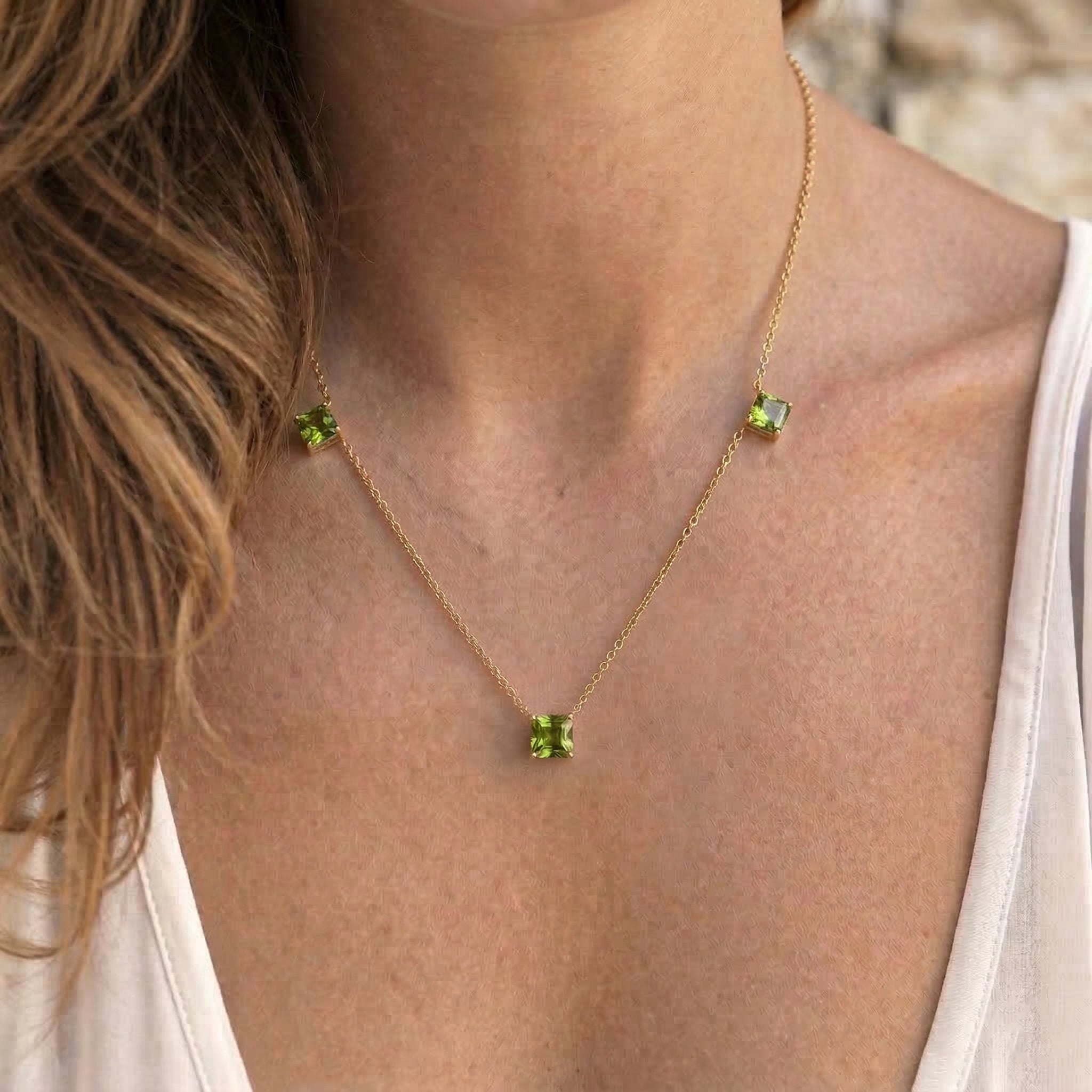 Natural Peridot three stone necklace in sterling silver.
