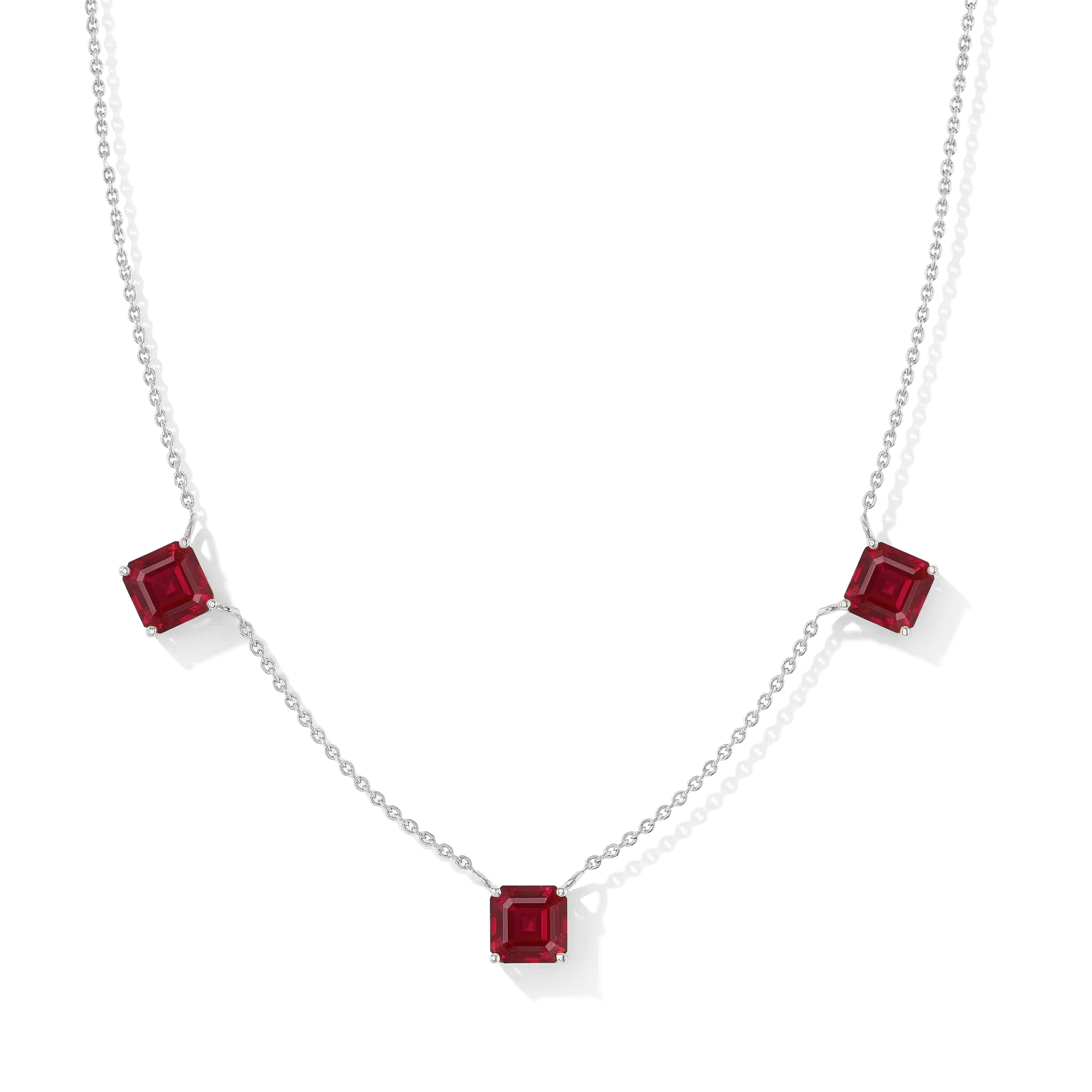 "Ruby Asscher cut station necklace in yellow gold filled and 925 sterling silver featuring three red gemstones.
