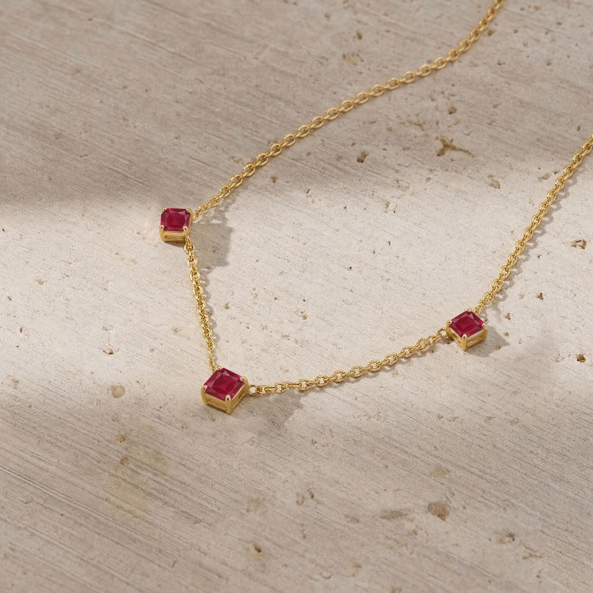 Luxury red gemstone necklace with natural Ruby stones and modern station necklace design.
