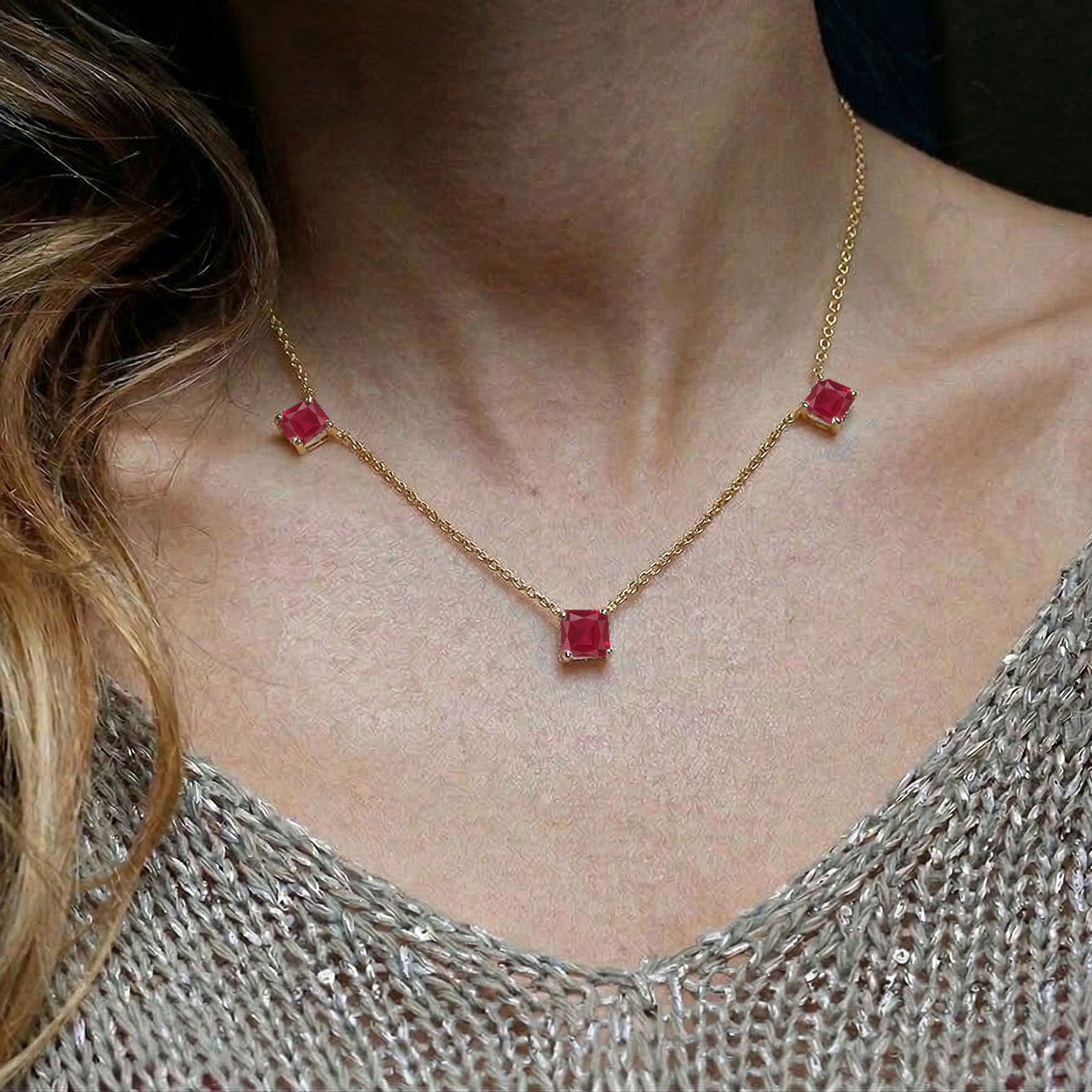 Ruby necklace featuring approximately 1.95 carat gemstone weight with adjustable 16 inch chain.

