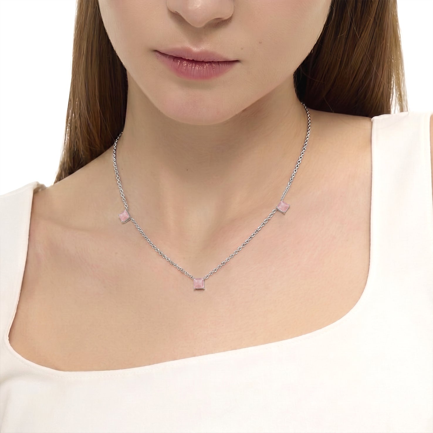 Women's Rose Quartz station necklace featuring soft pink gemstones with luxury gold filled chain.
