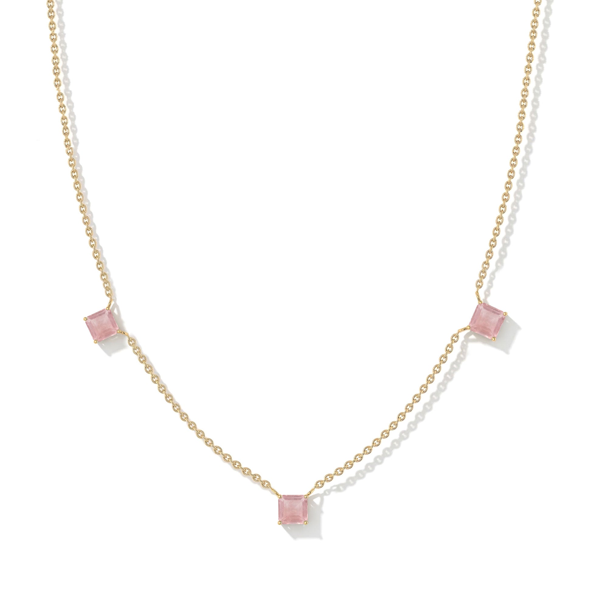 Minimalist pink gemstone necklace with Rose Quartz stones and sterling silver craftsmanship.
