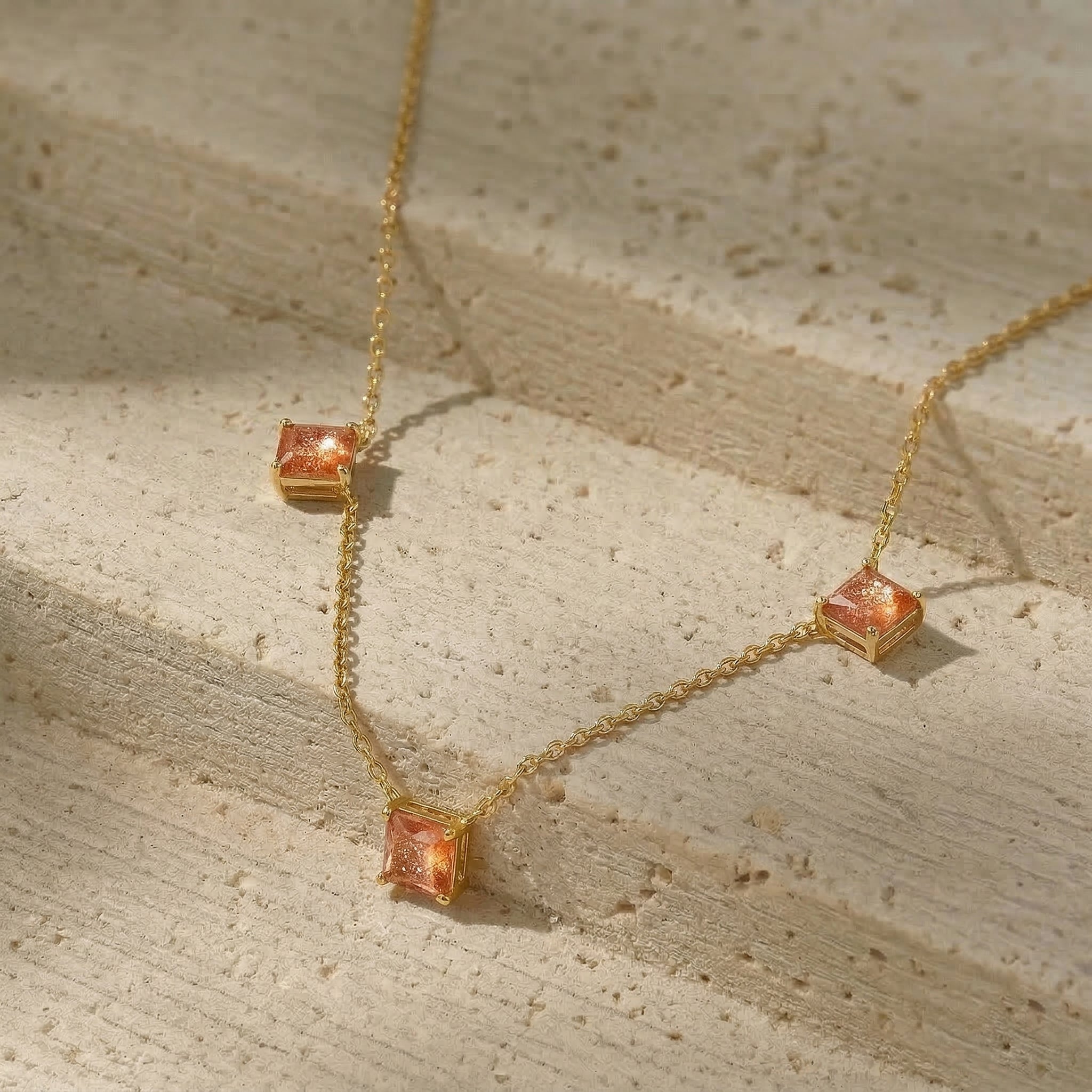 Luxury Asscher cut Sunstone necklace with three gemstones for fine jewelry lovers.
