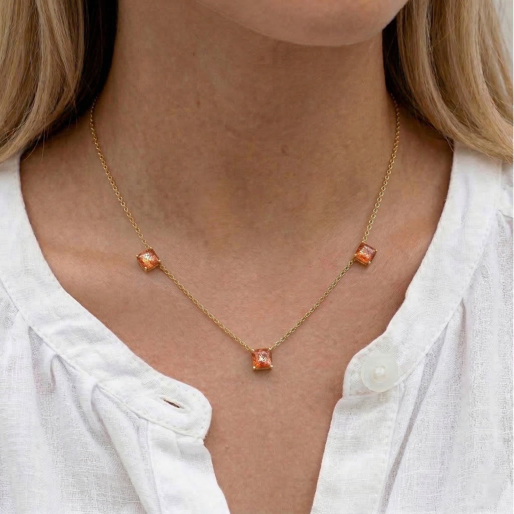 Women's Sunstone station necklace featuring warm glowing gemstones with luxury gold filled chain.

