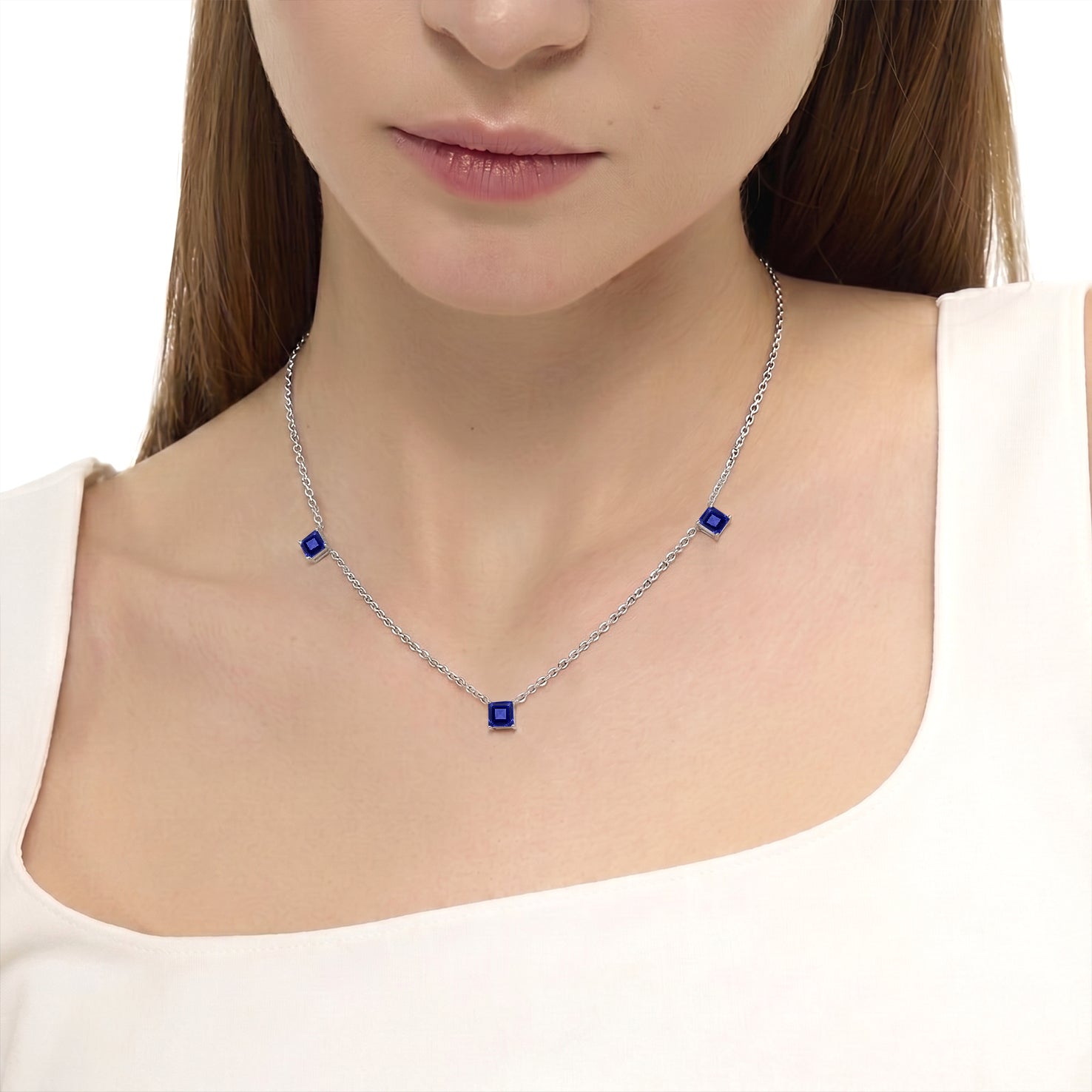 Women's Tanzanite station necklace featuring rare blue purple gemstones with luxury gold filled chain.
