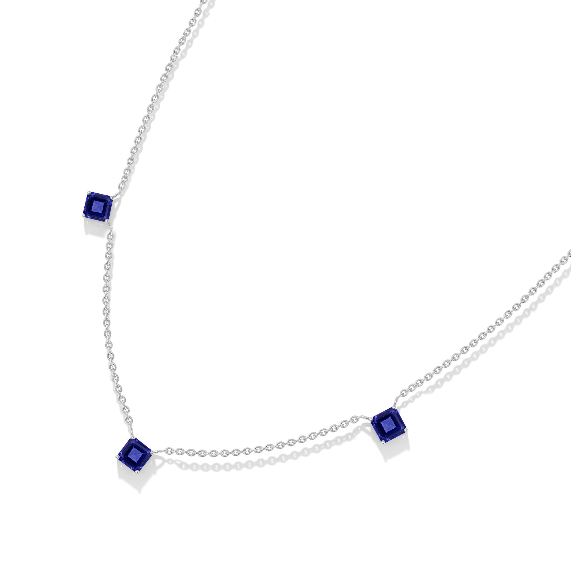 Timeless Tanzanite three stone station necklace with Asscher cut stones.
