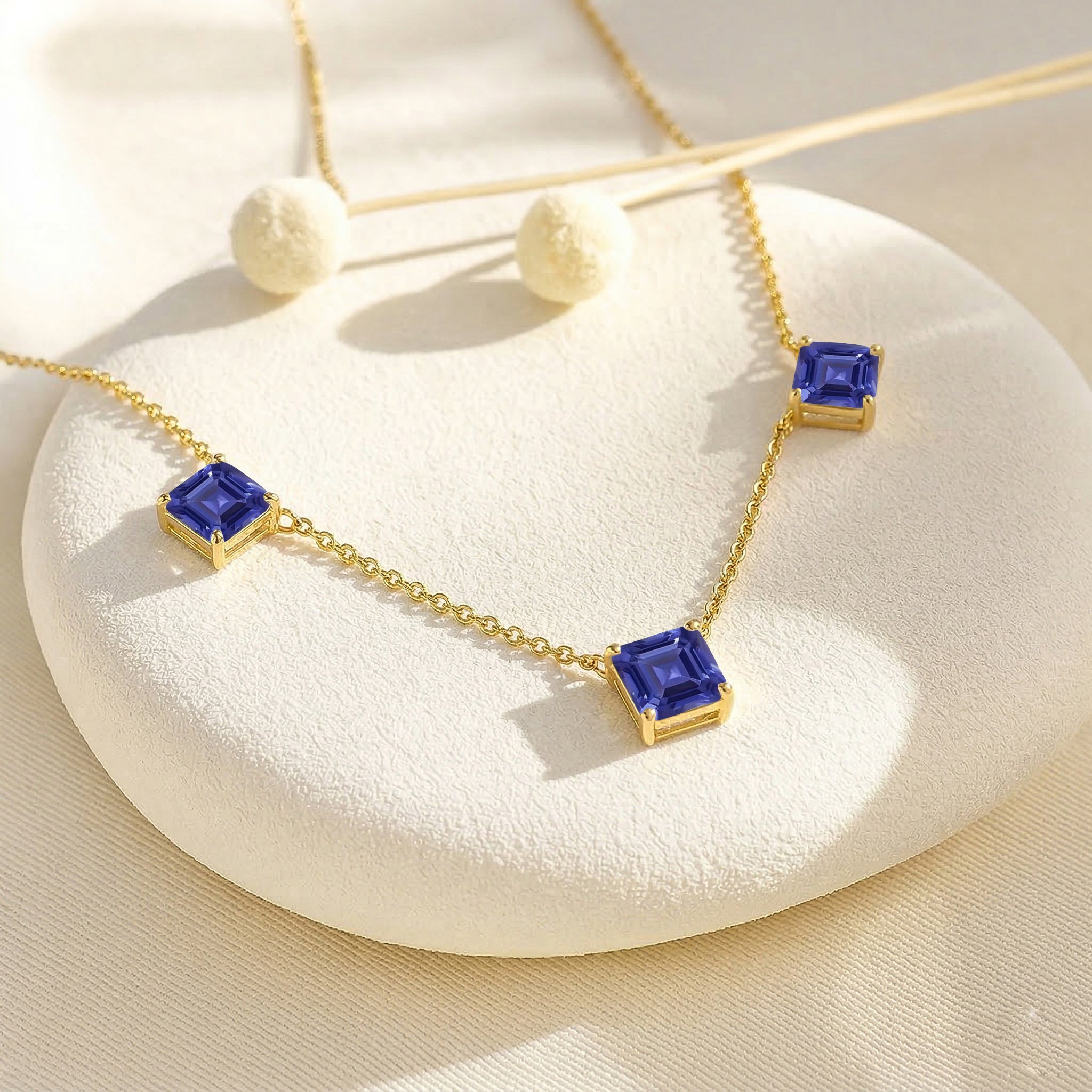 Fine gemstone Tanzanite necklace featuring Asscher cut stones for layering and special occasions.
