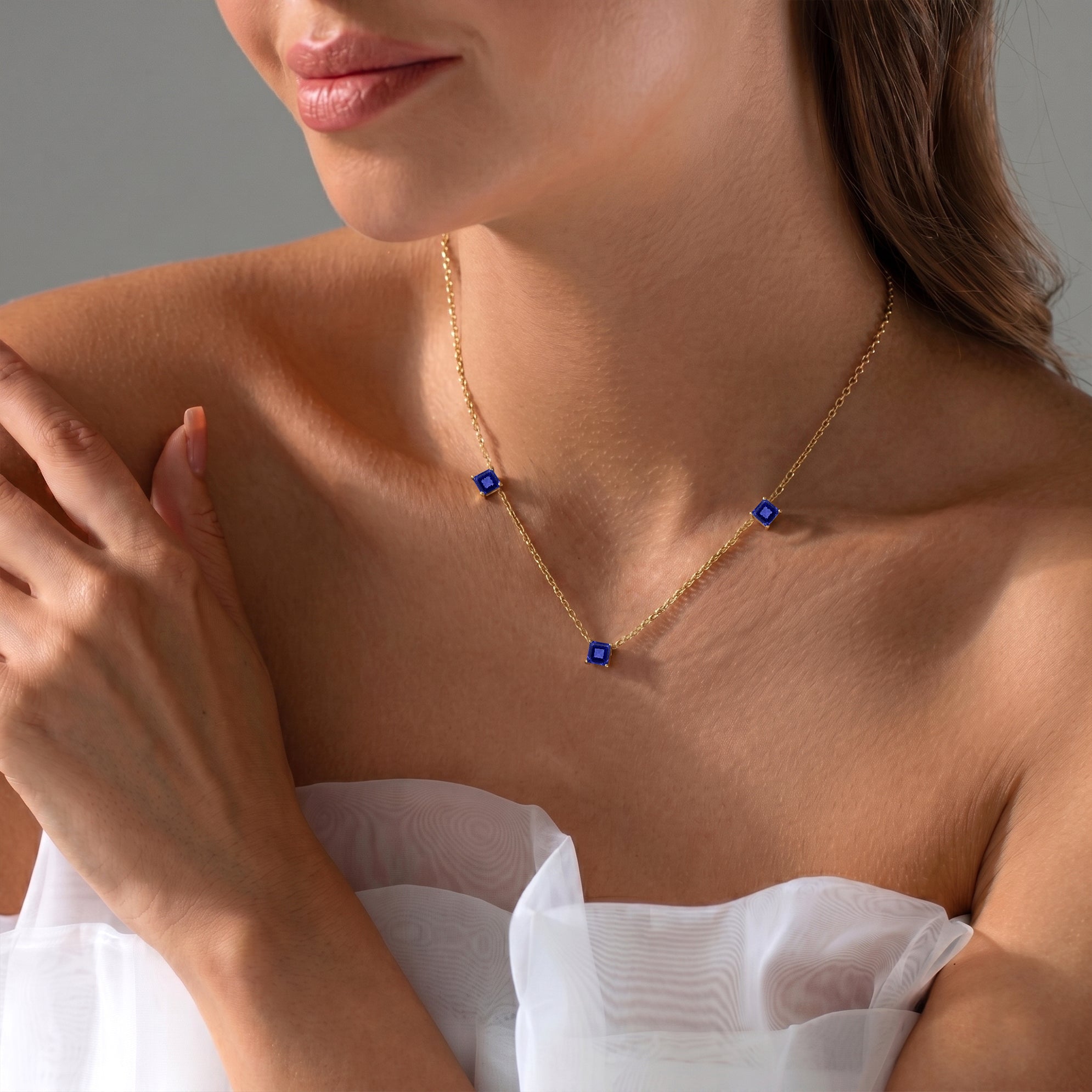 Luxury Asscher cut Tanzanite necklace with three gemstones for fine jewelry lovers.
