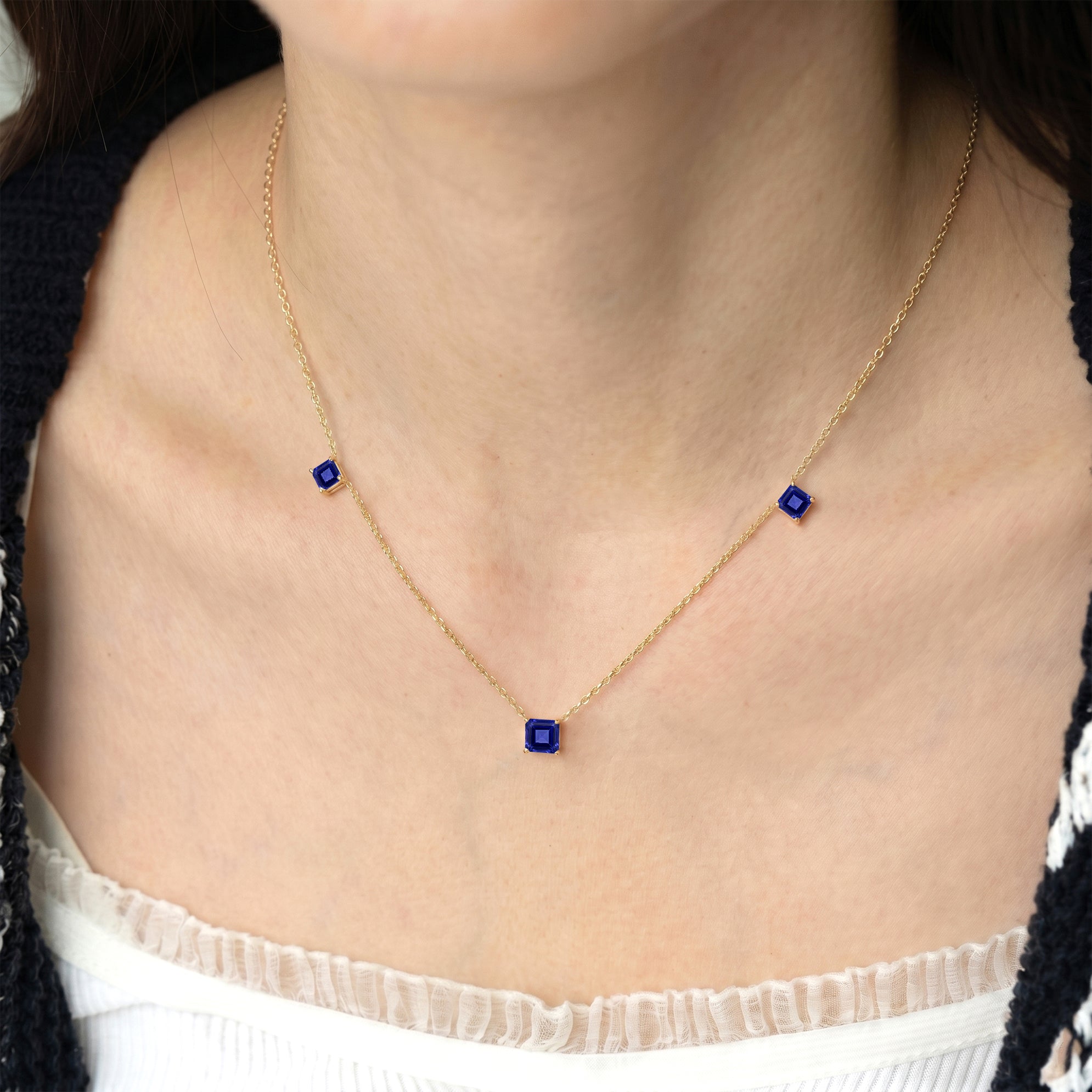 Blue violet gemstone necklace with natural Tanzanite stones and modern station necklace design.
