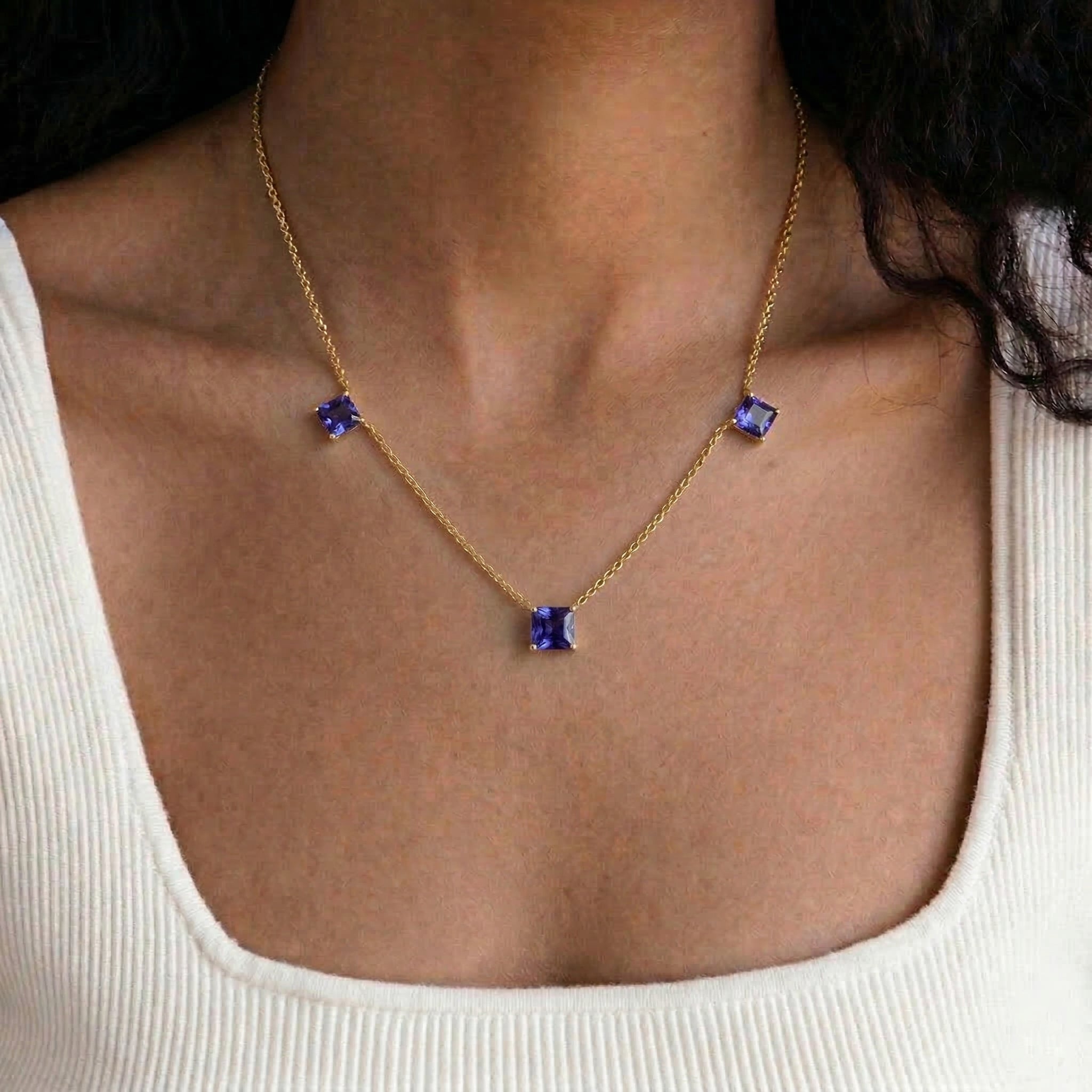 Natural Tanzanite station necklace with blue violet gemstones.
