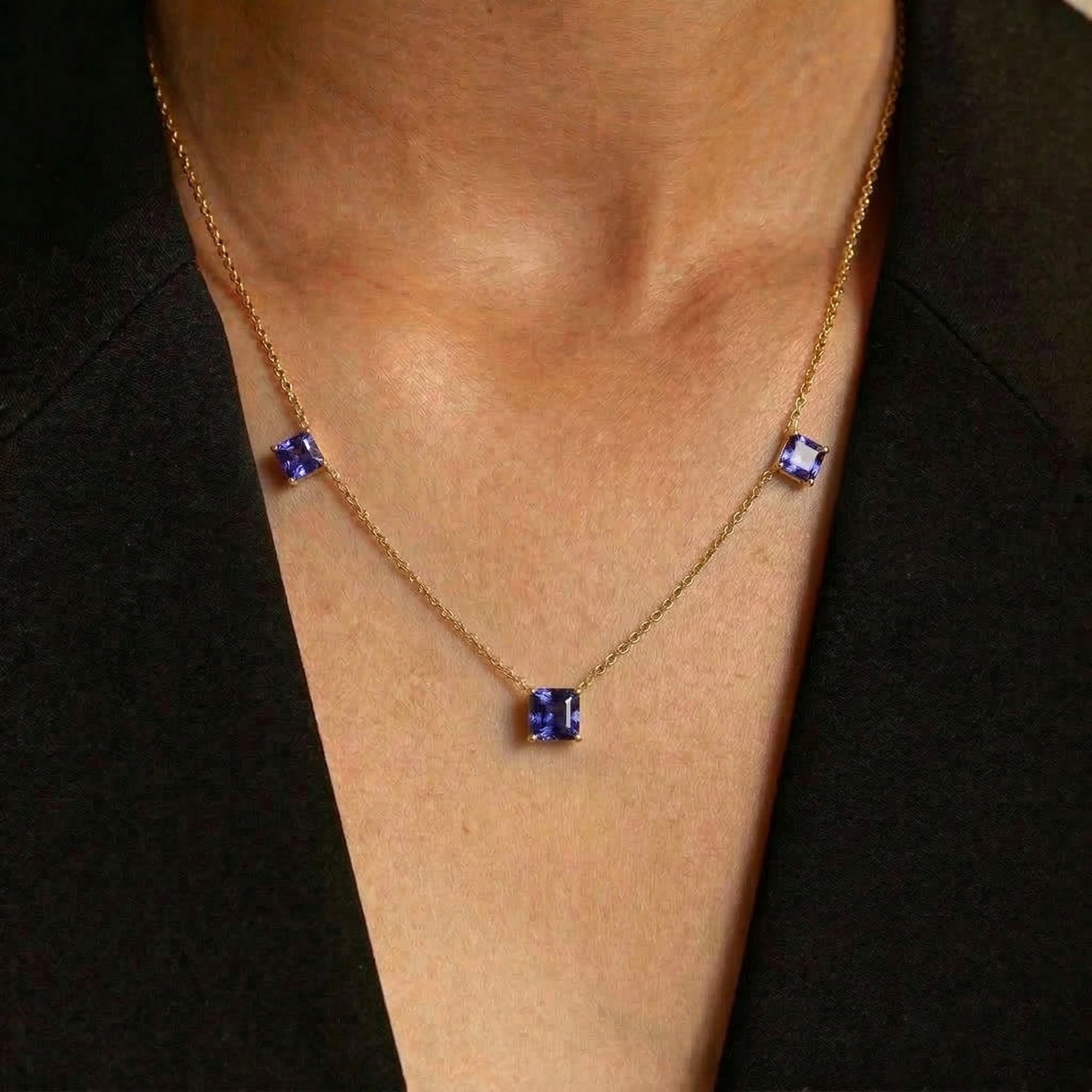 Minimalist purple gemstone necklace with Tanzanite stones and sterling silver craftsmanship.

