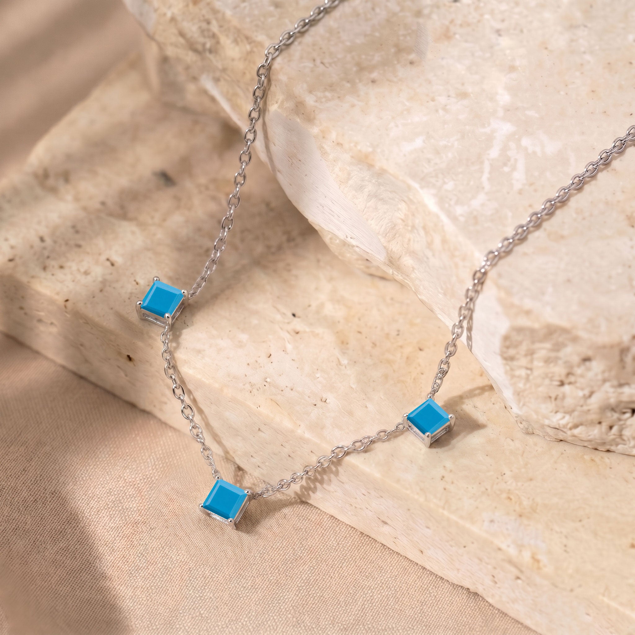 December birthstone Turquoise necklace with elegant three stone design for women.
