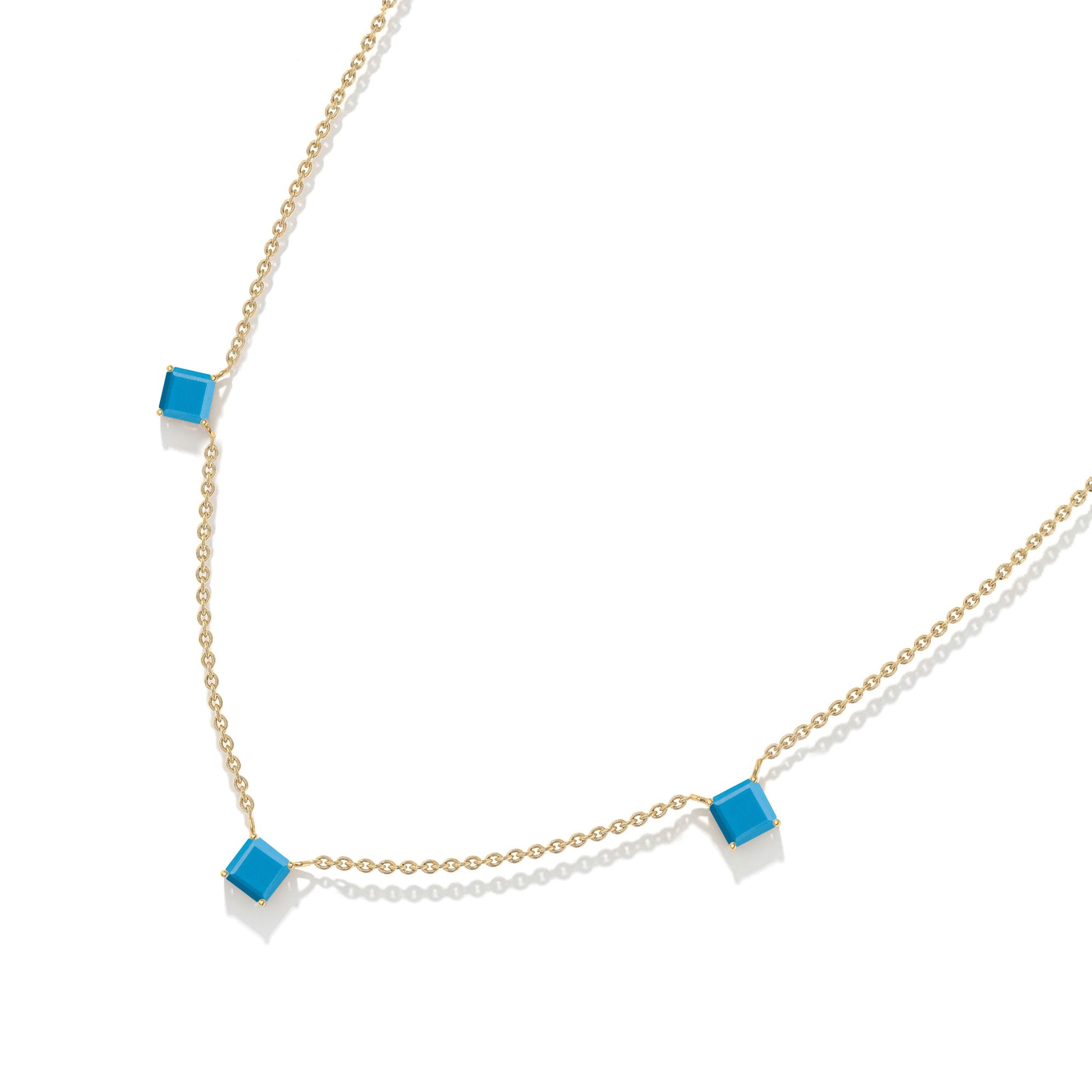 Minimalist blue green gemstone necklace with Turquoise stones and sterling silver craftsmanship.

