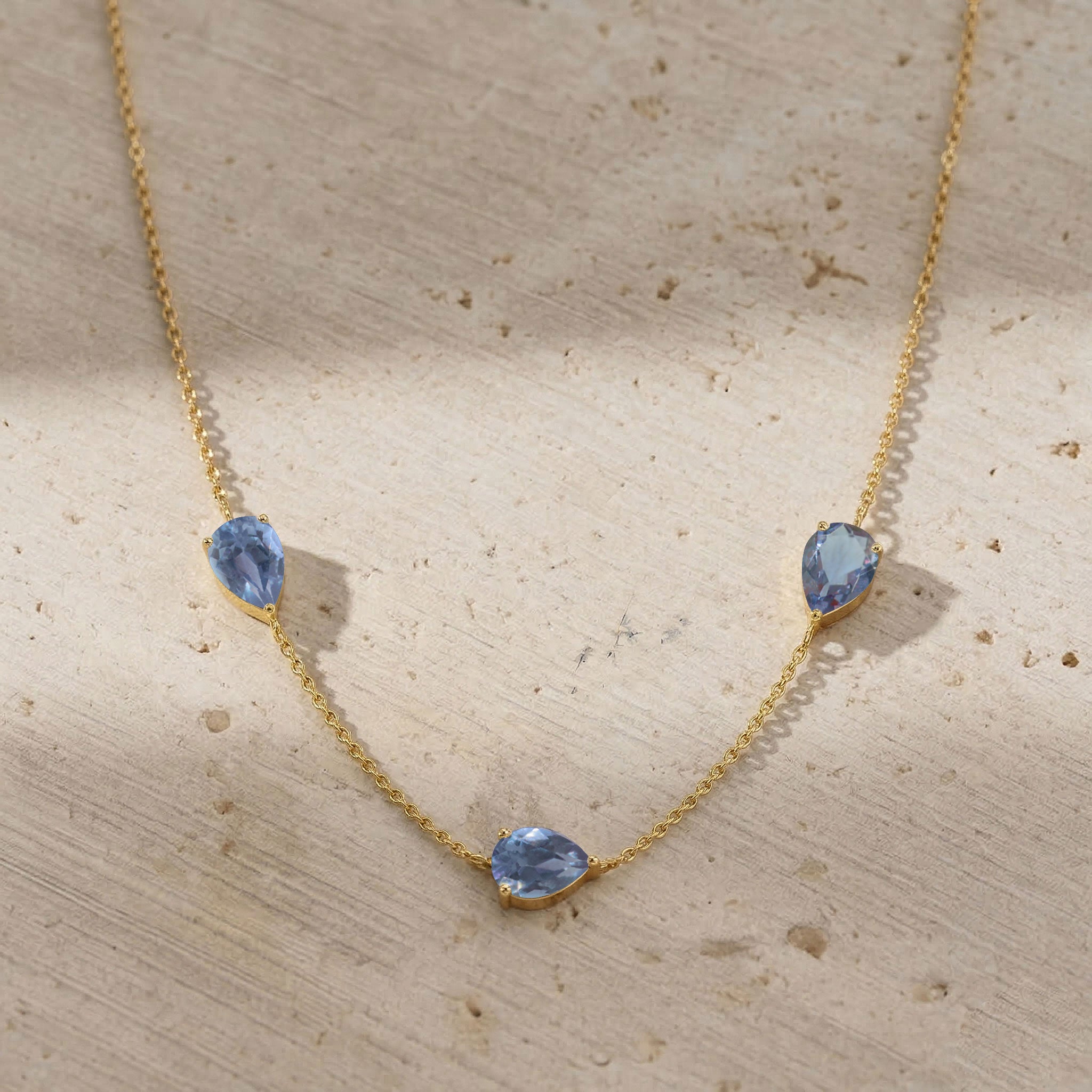 Yellow gold filled Alexandrite necklace with three gemstones.
