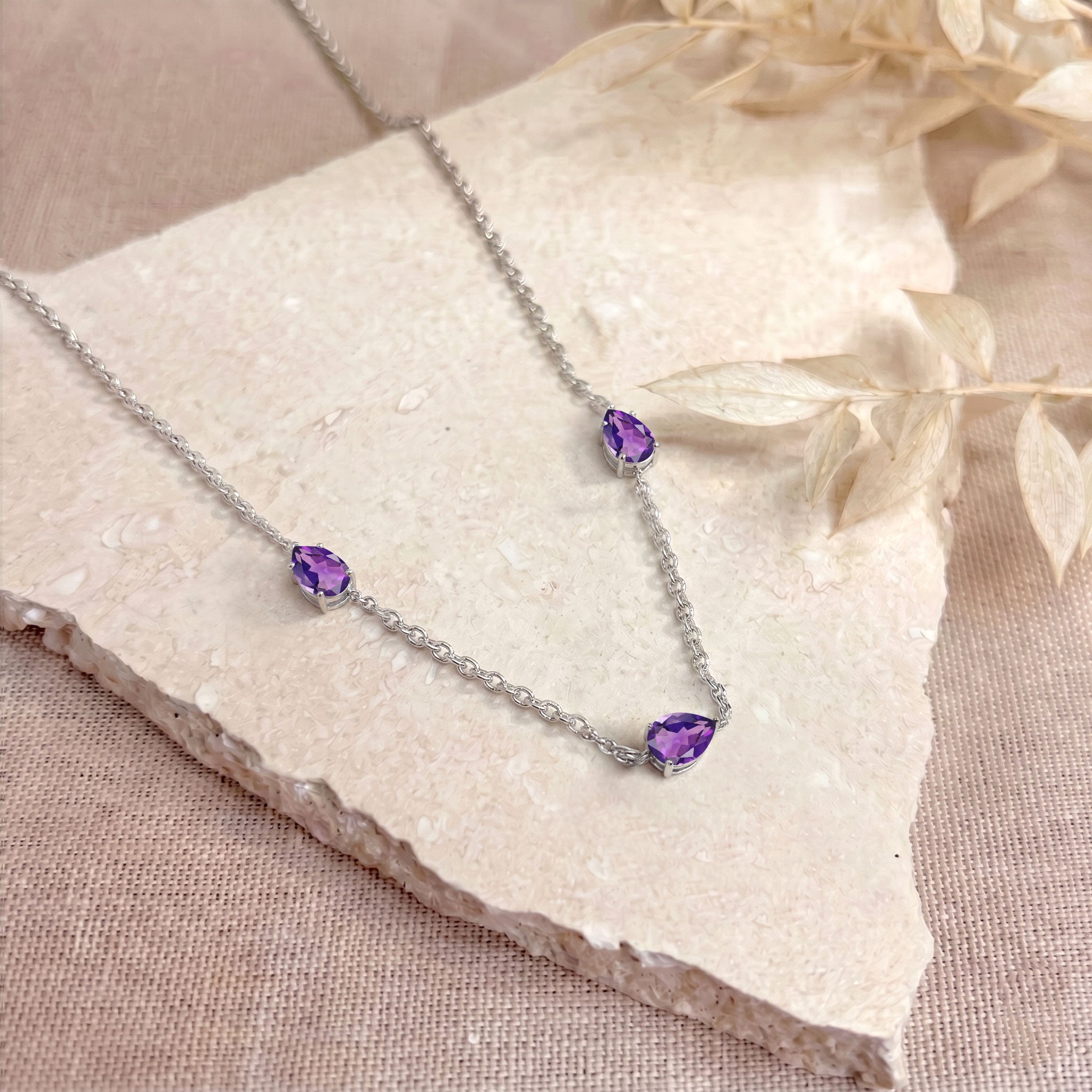 Three stone Amethyst necklace with yellow gold filled finish.
