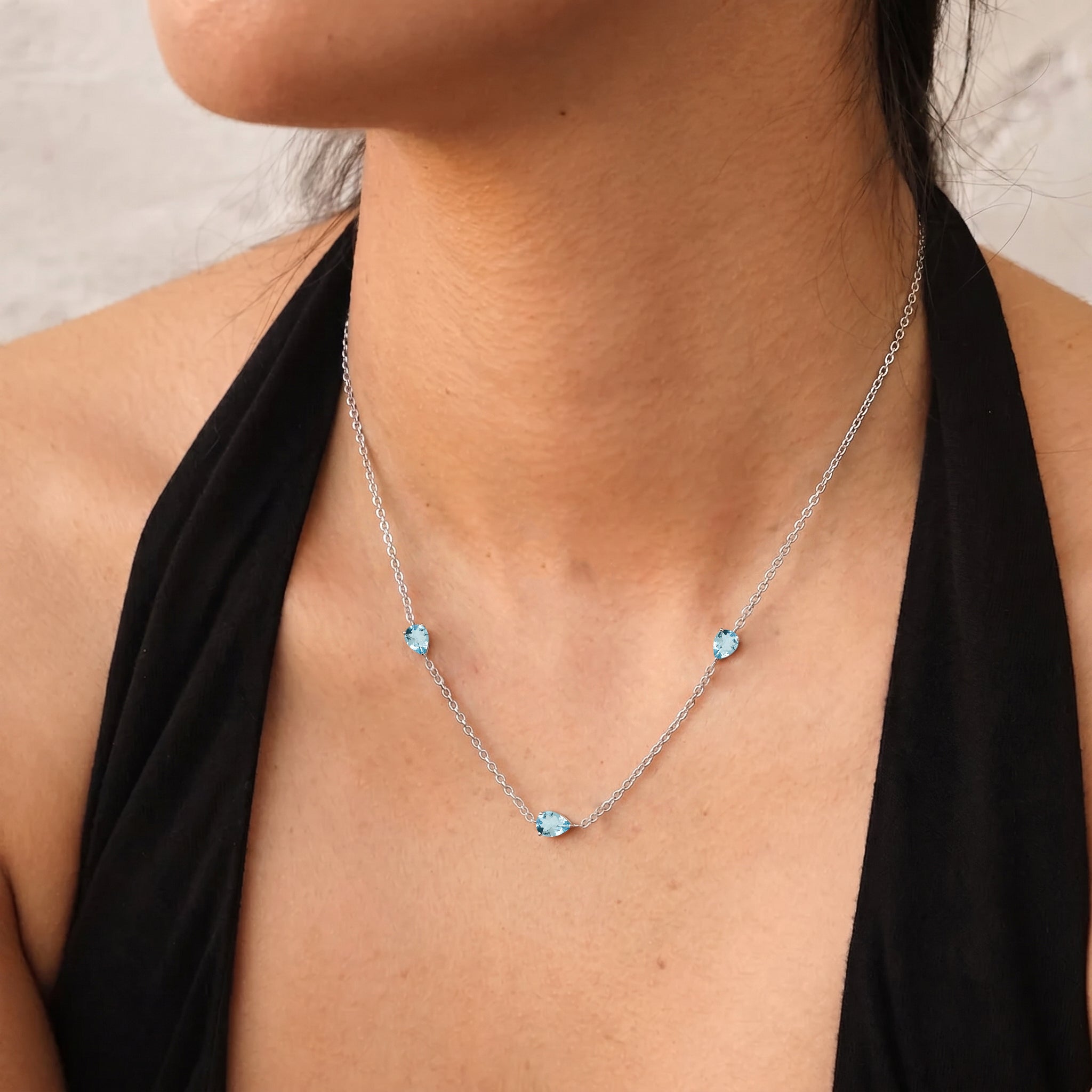 Aquamarine three stone pear necklace featuring March birthstone gemstones
