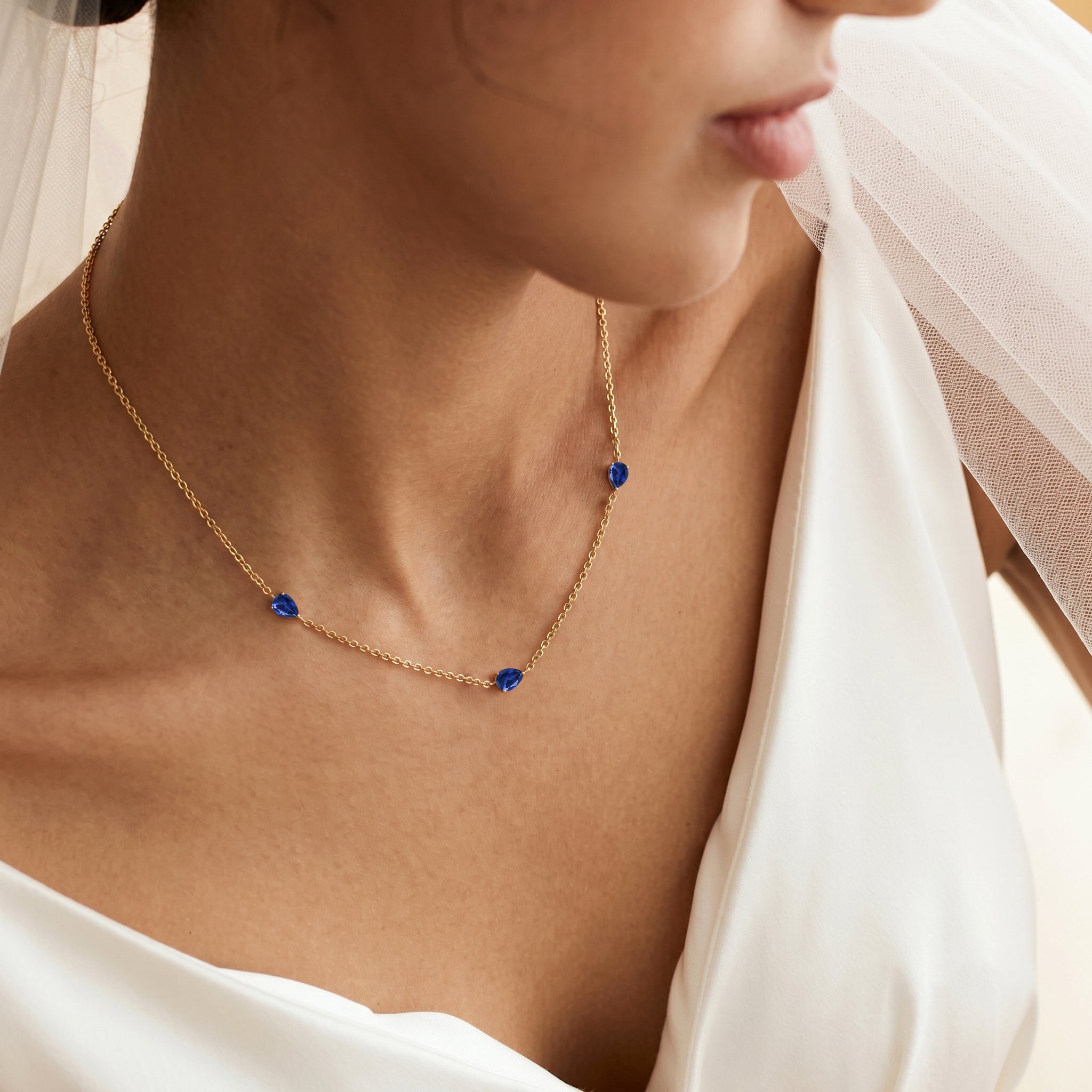 Luxury Blue Sapphire necklace with three stone design
