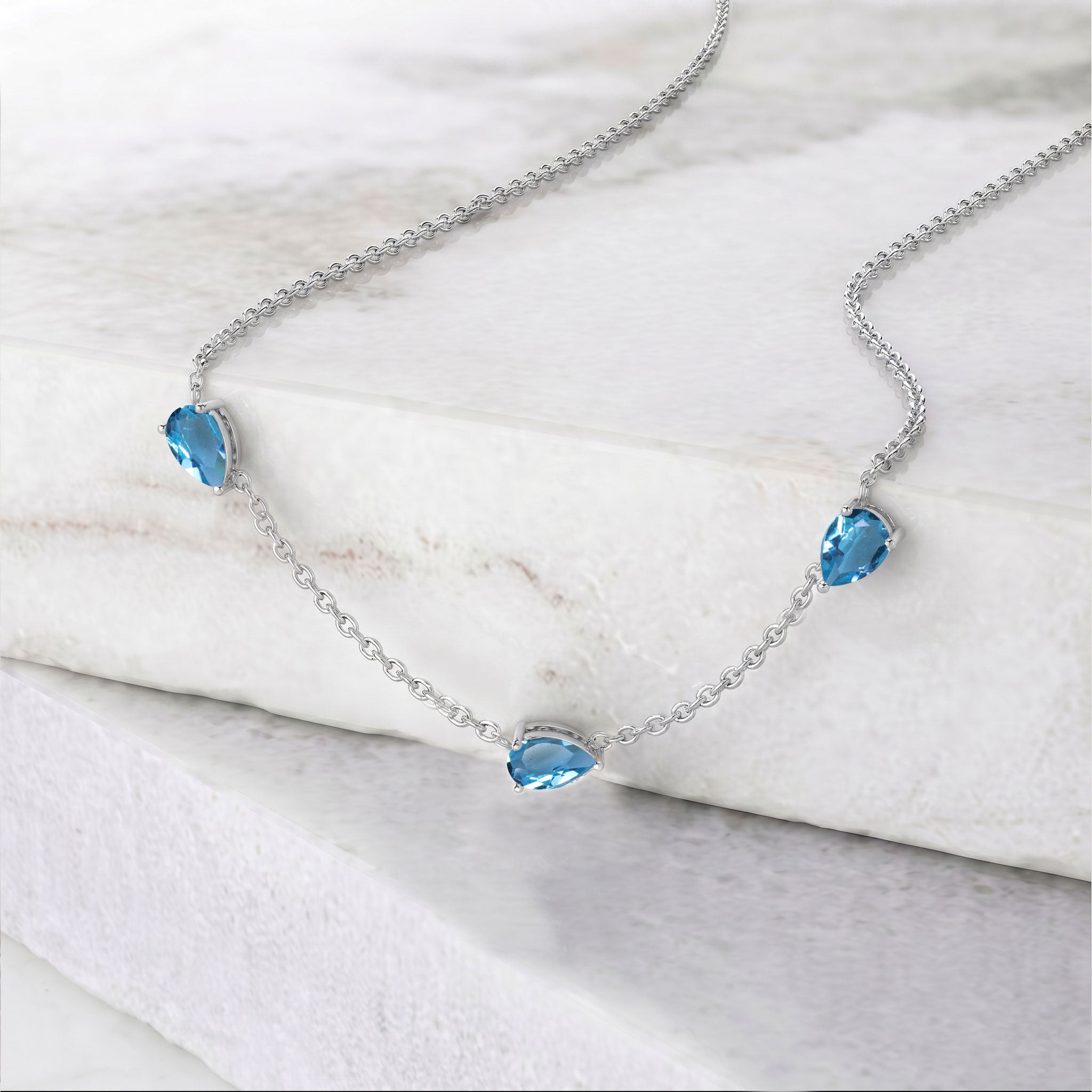 
Yellow gold filled Blue Topaz necklace with three pear cut stones